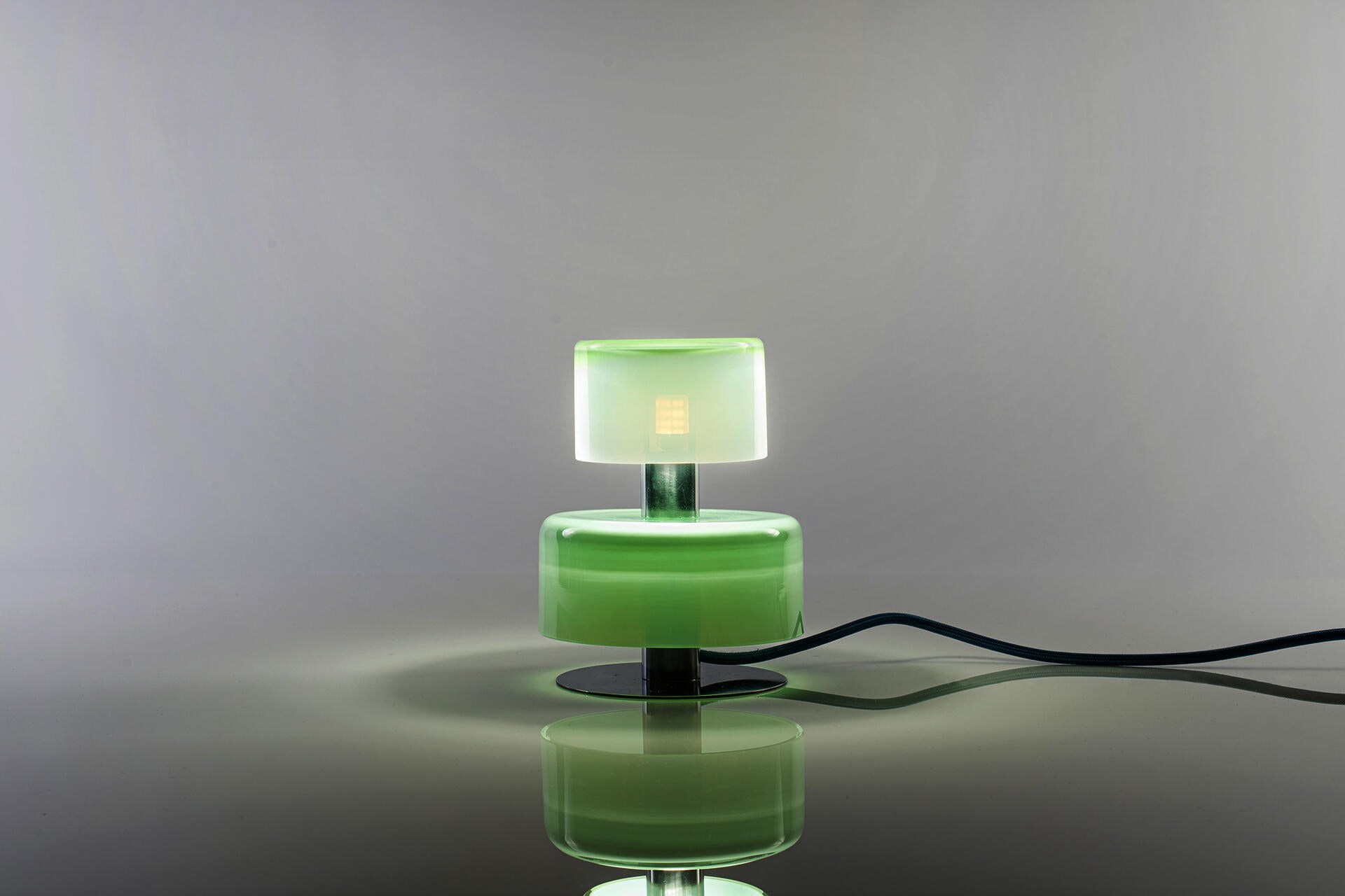 A night lamp with three part of hand-made blown forms. It is a stackable modular system