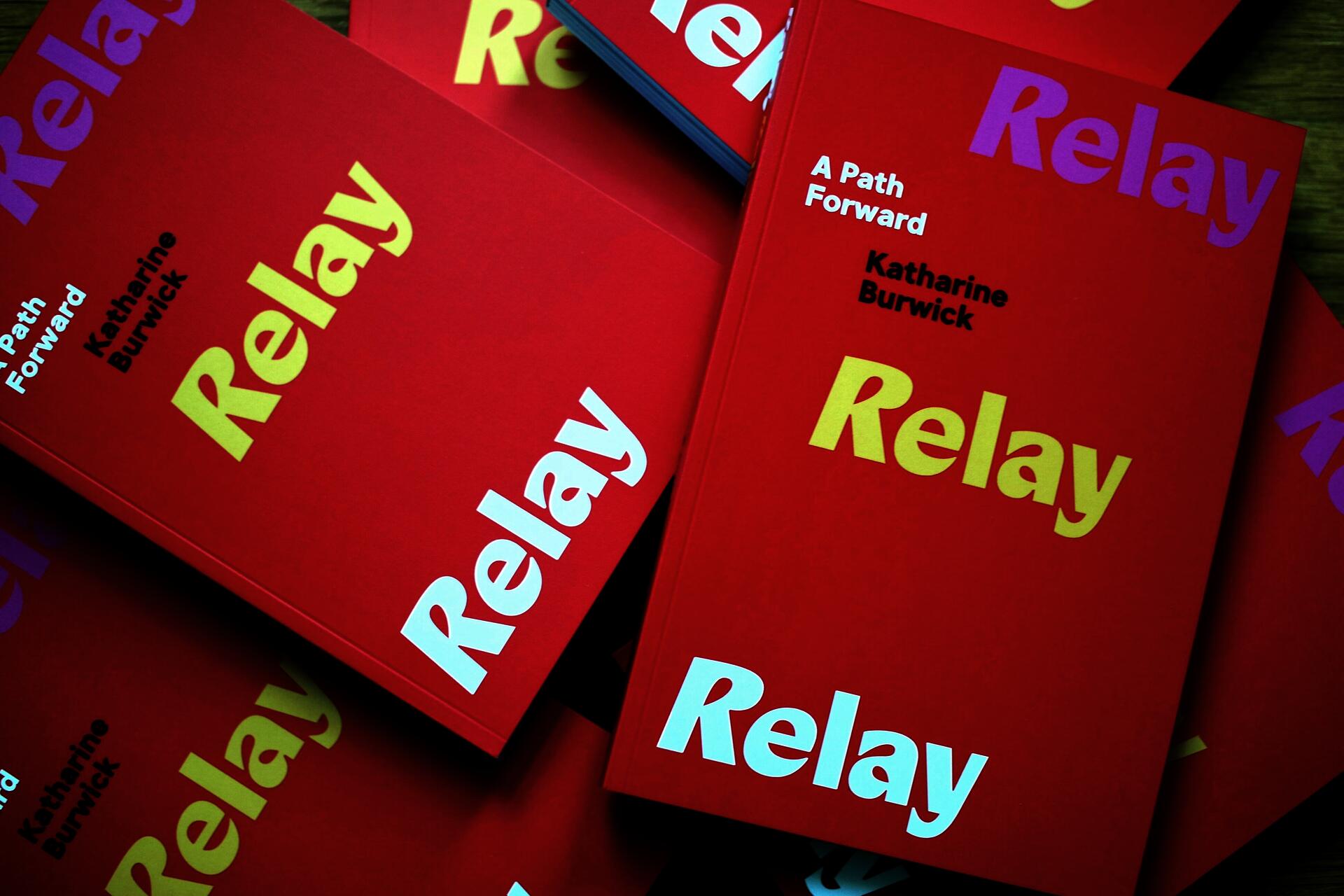 Stack of red books with "Relay" repeated 3 times, and "A Path Forward" with the author's name in parallel