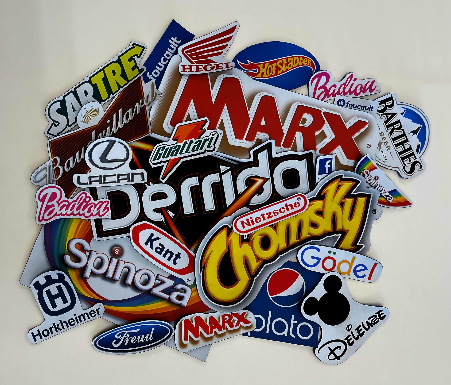 A stack of patches with logos of common brands edited to replace the brand name with a theorist's name.