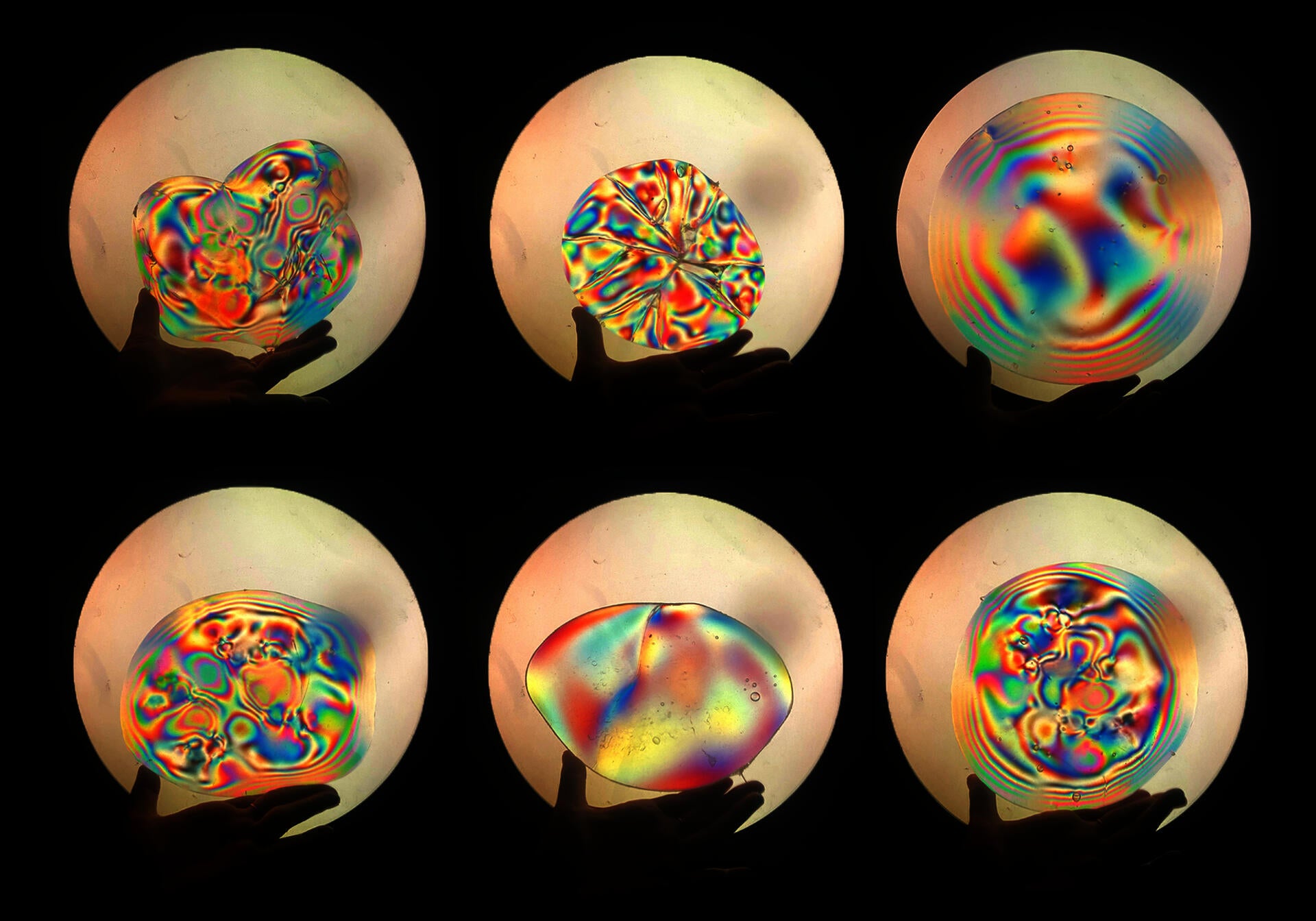 Observing stressed glass pieces through a polariscope.