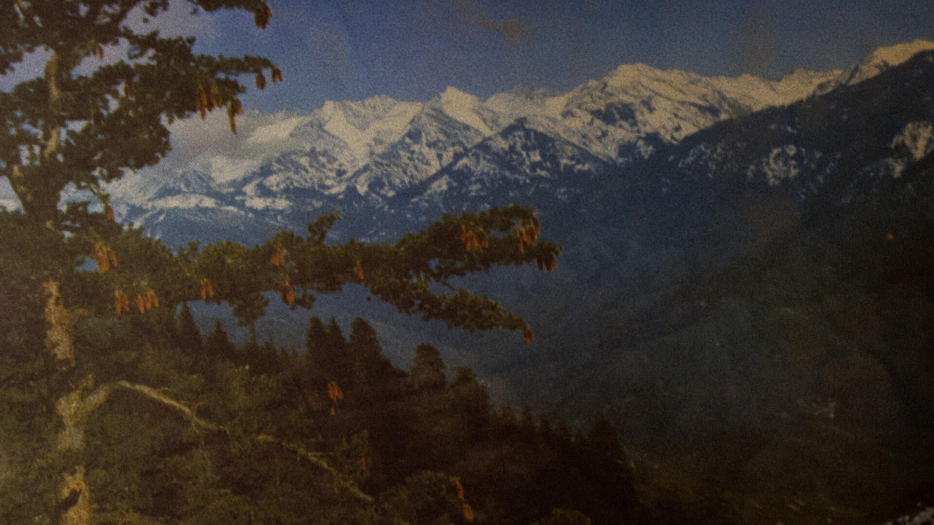 A close up of a picture depicting a mountain scene.