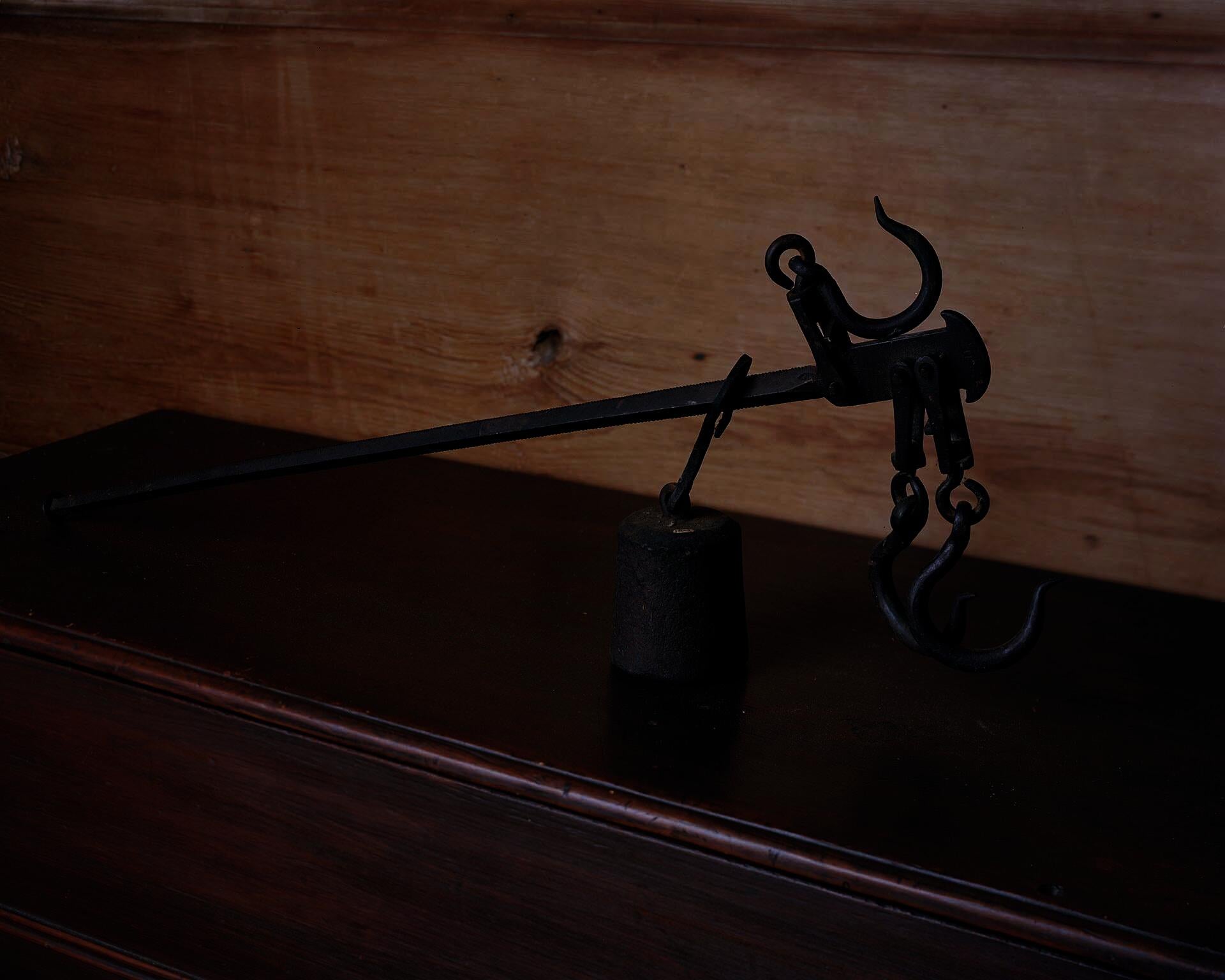 Photograph of a singular cotton scale on top of a dresser.