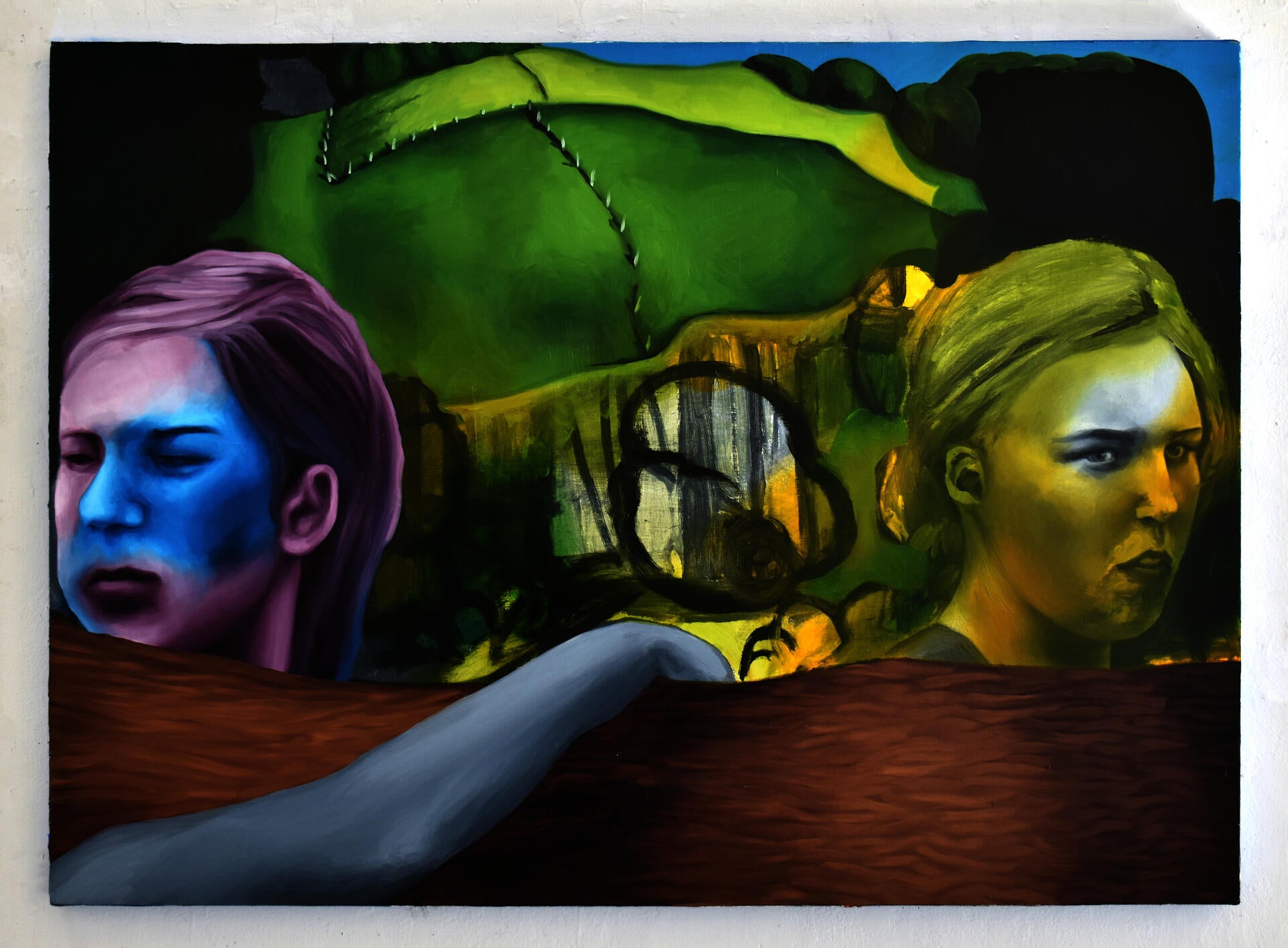 Painting of two girls looking out of the painting, blocked by a fallen tree with a Grant Wood painting copy in the background.