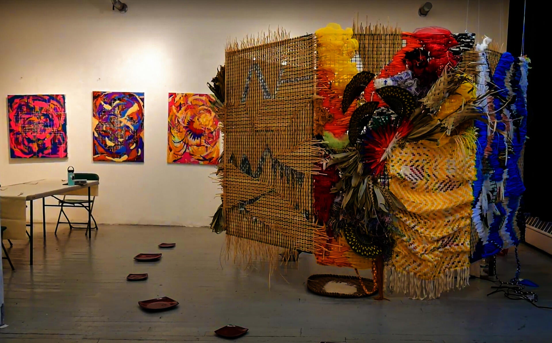 Complicating viewership and participation while implicating the audience with performance with food, chanting, costuming, and weaving.