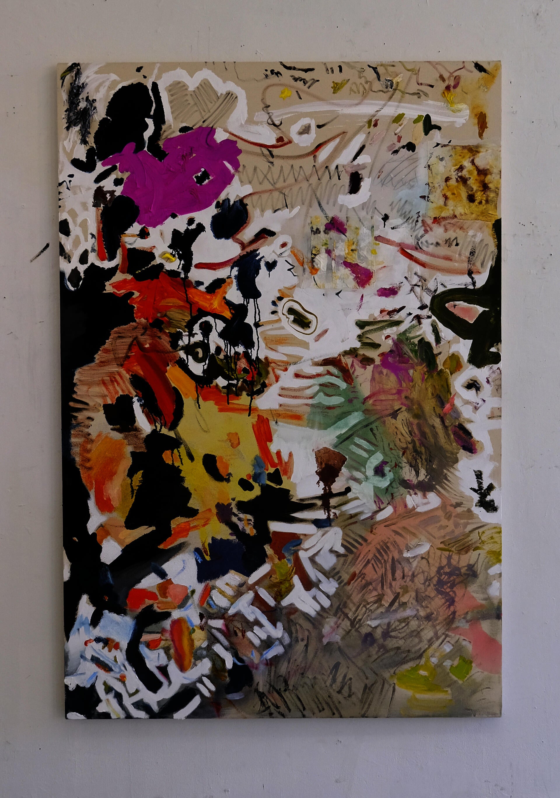 An vertical abstract painting with doodly lines, blobs of pink and red, and some stuck on rags.