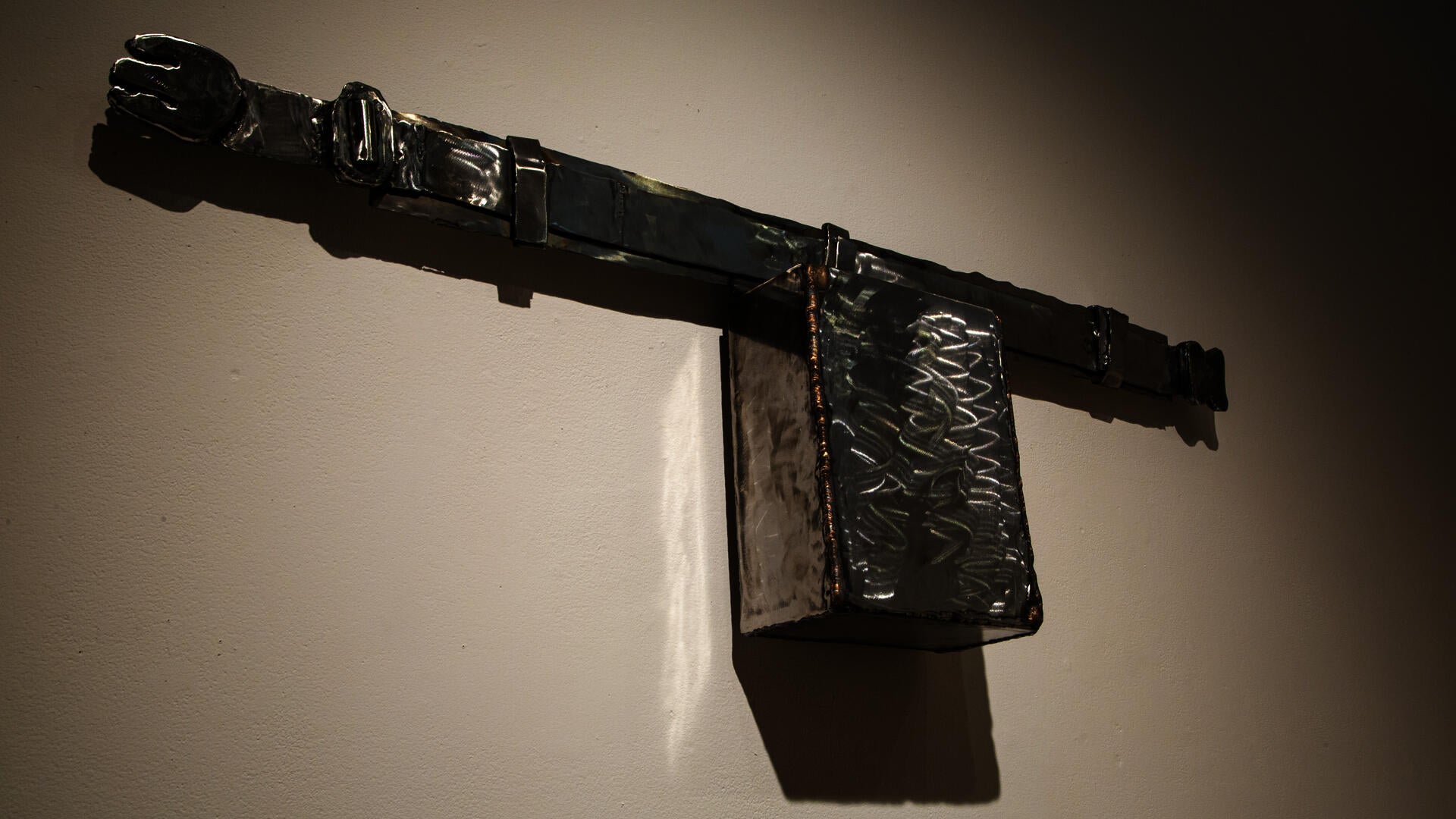 Military tool pouch reimagined in polished steel