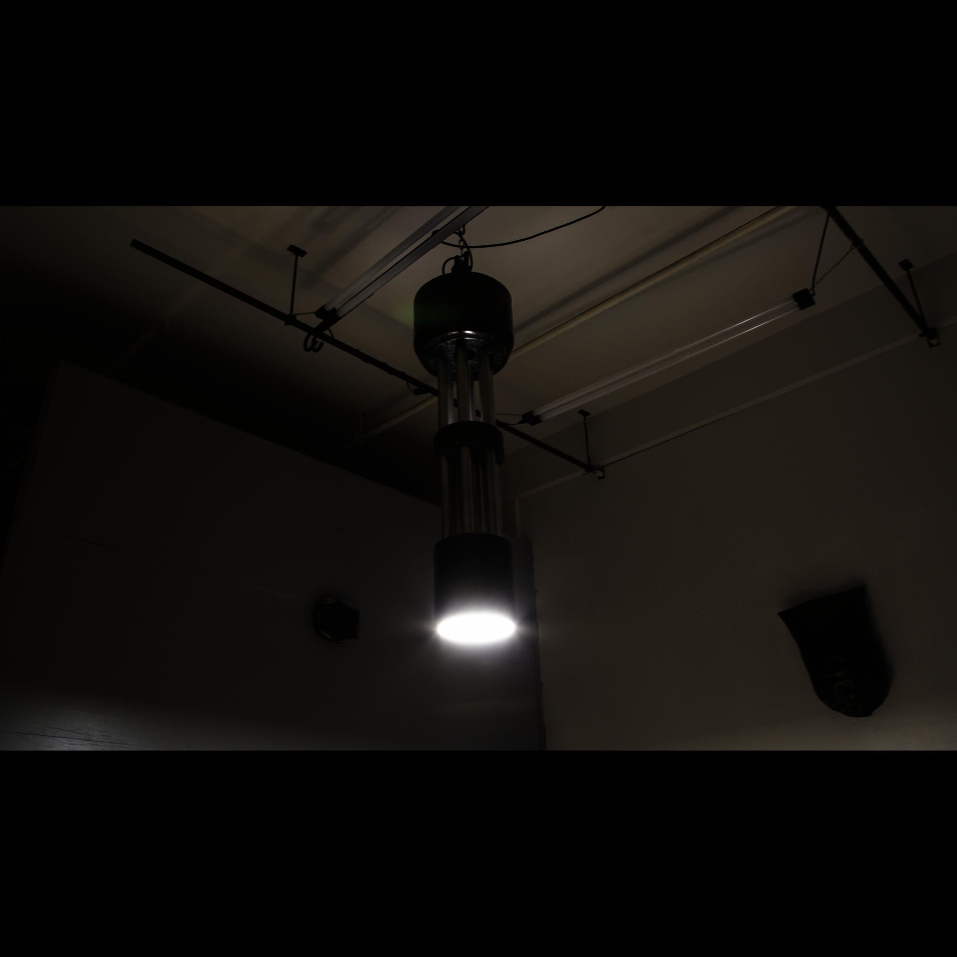 Chandelier roughly four feet tall and fourteen inches in diameter, the chandelier is modeled after and in close scale to air cannon's found on combat aircraft, this chandelier is constructed of rapid prototyping extrusion covered in carbon fiber, the light segments are aluminum.
