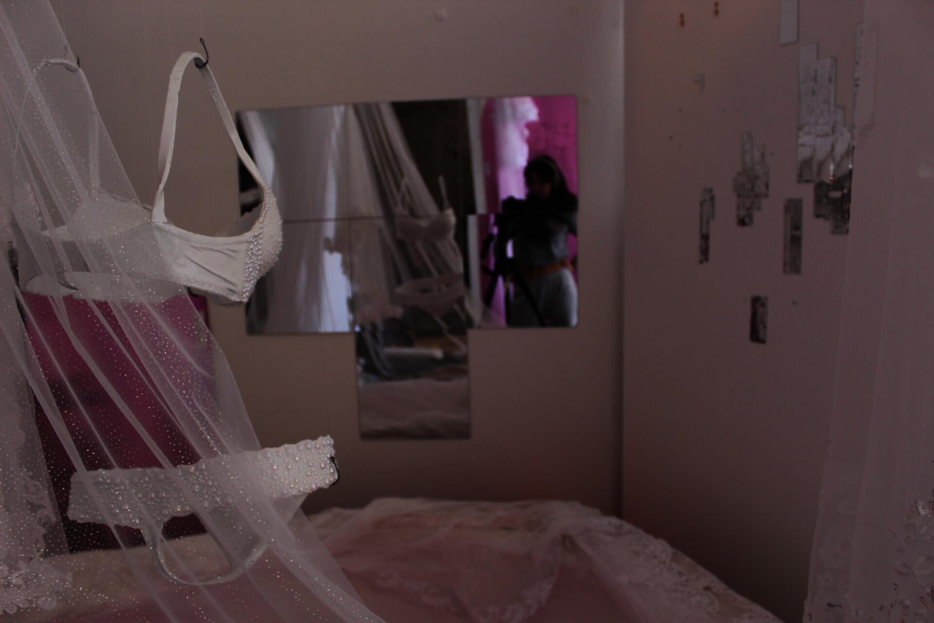 An image of the artist is reflected in the mirror.