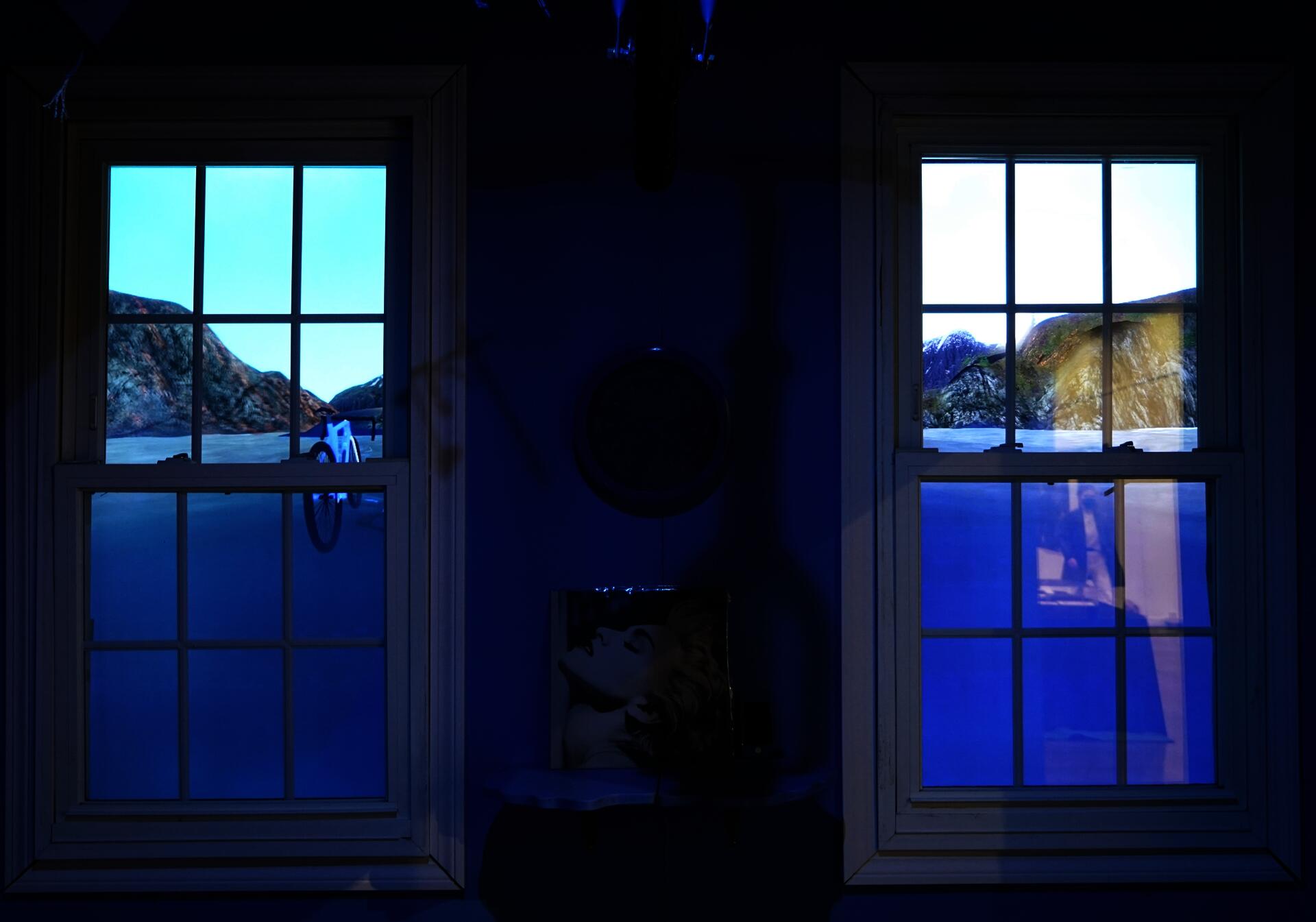 Self-playing video game displayed across two monitors, installed behind two windows