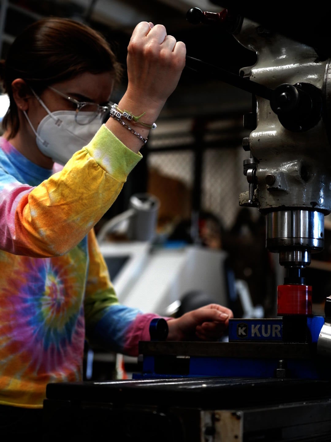 Image of the artist cutting carbon frame tubing for bicycle construction