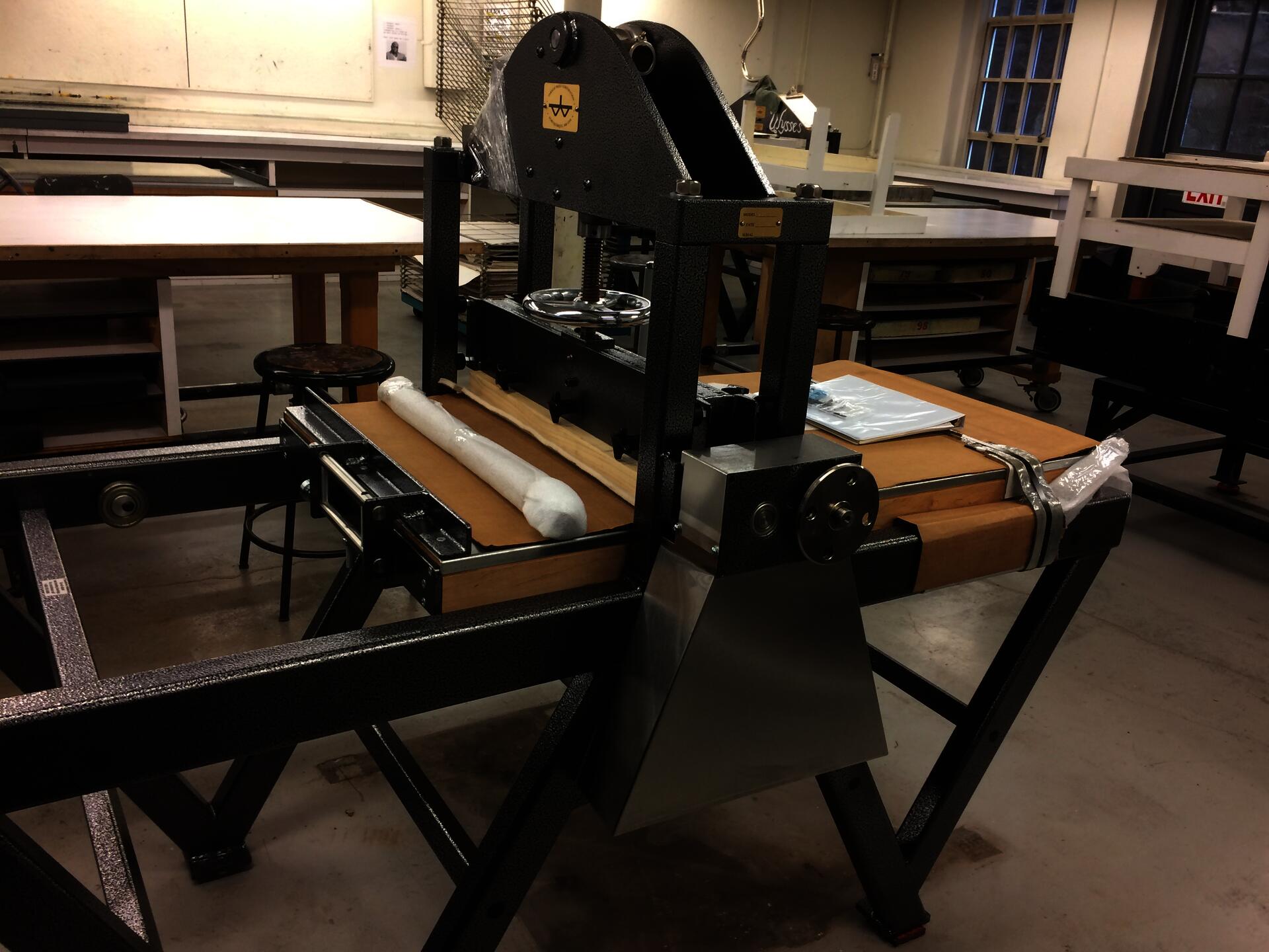 color photograph of a metal printmaking press