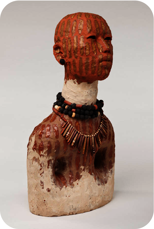 Clay bust featuring a terracotta head with golden stripes of paint, a white neck with black and brown beaded necklaces, and a terracotta striped bust with white at the base.