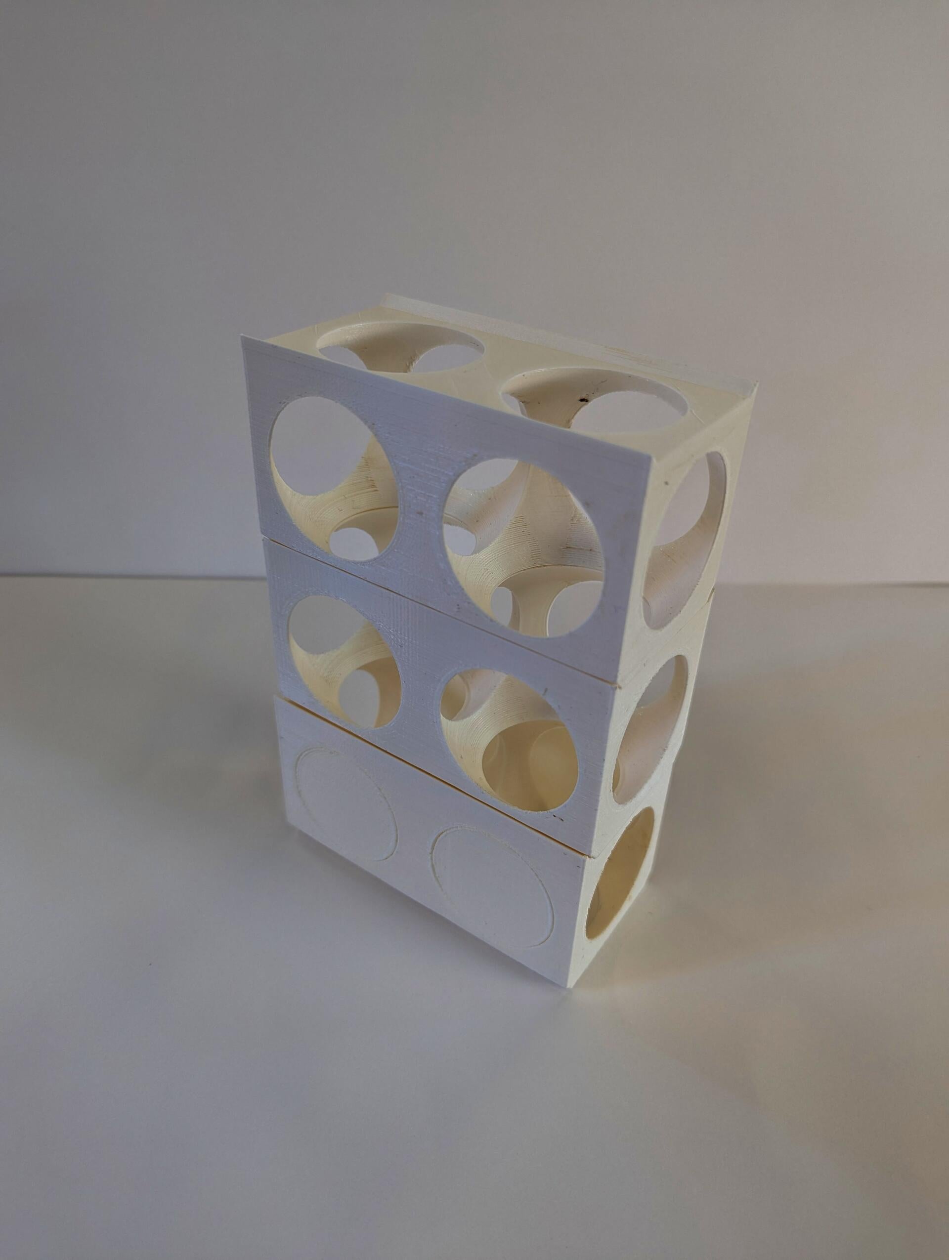 3D printed rectilinear block is voided via 2 spheres to create a skeletal frame.