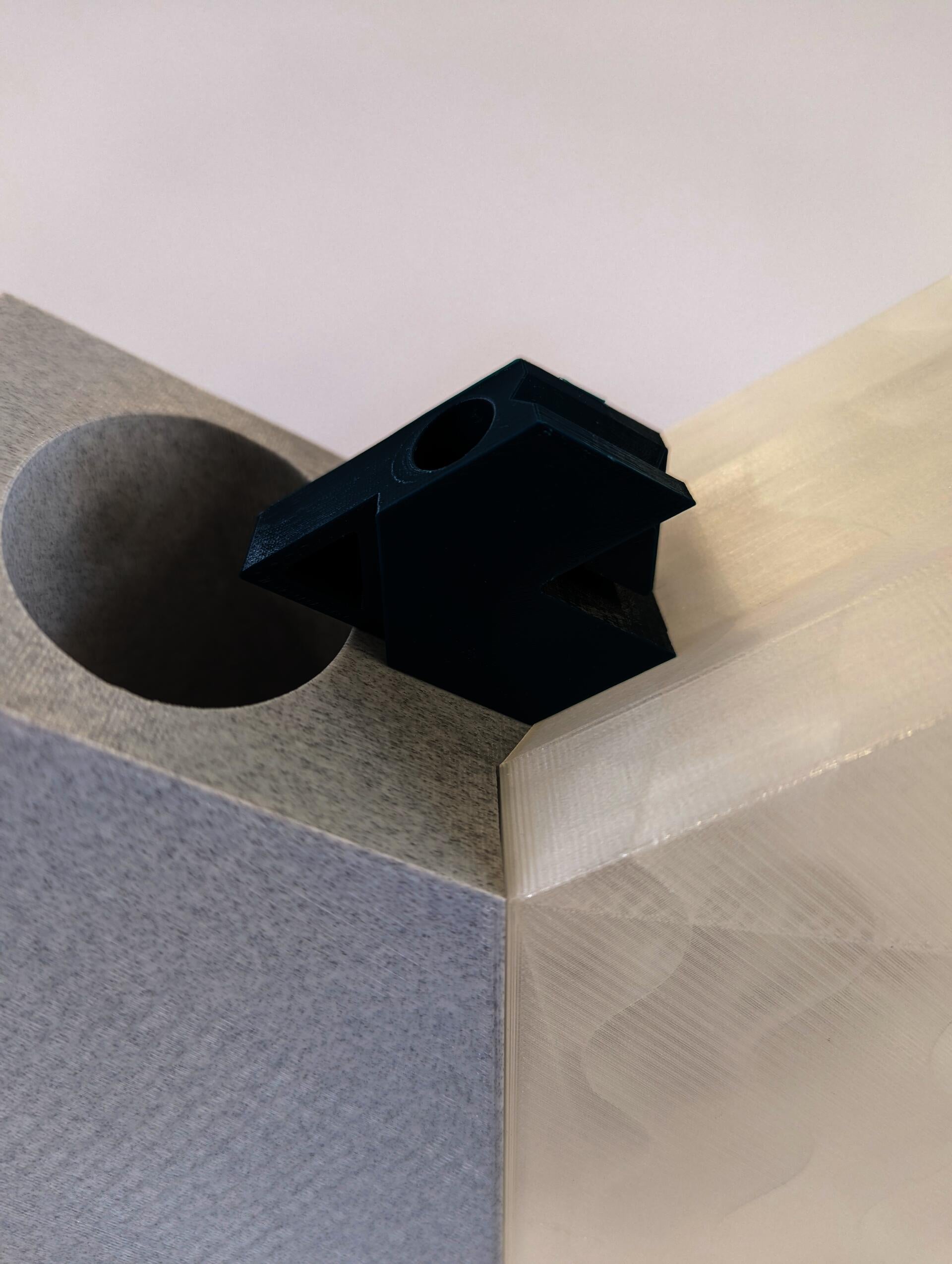 Scale hexagon block model sits between full size models