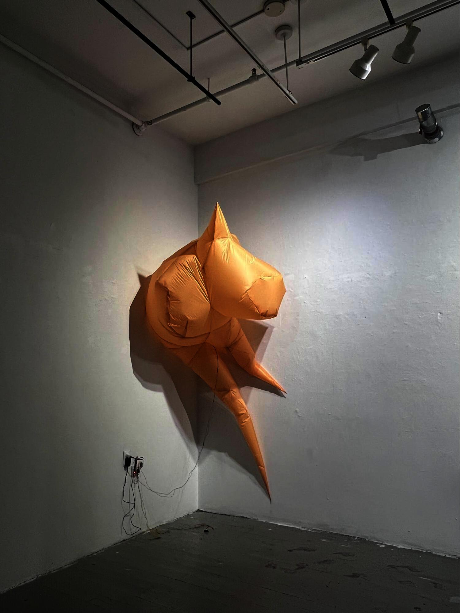 A fully inflated, mirage-like inflatable object made of fabric.