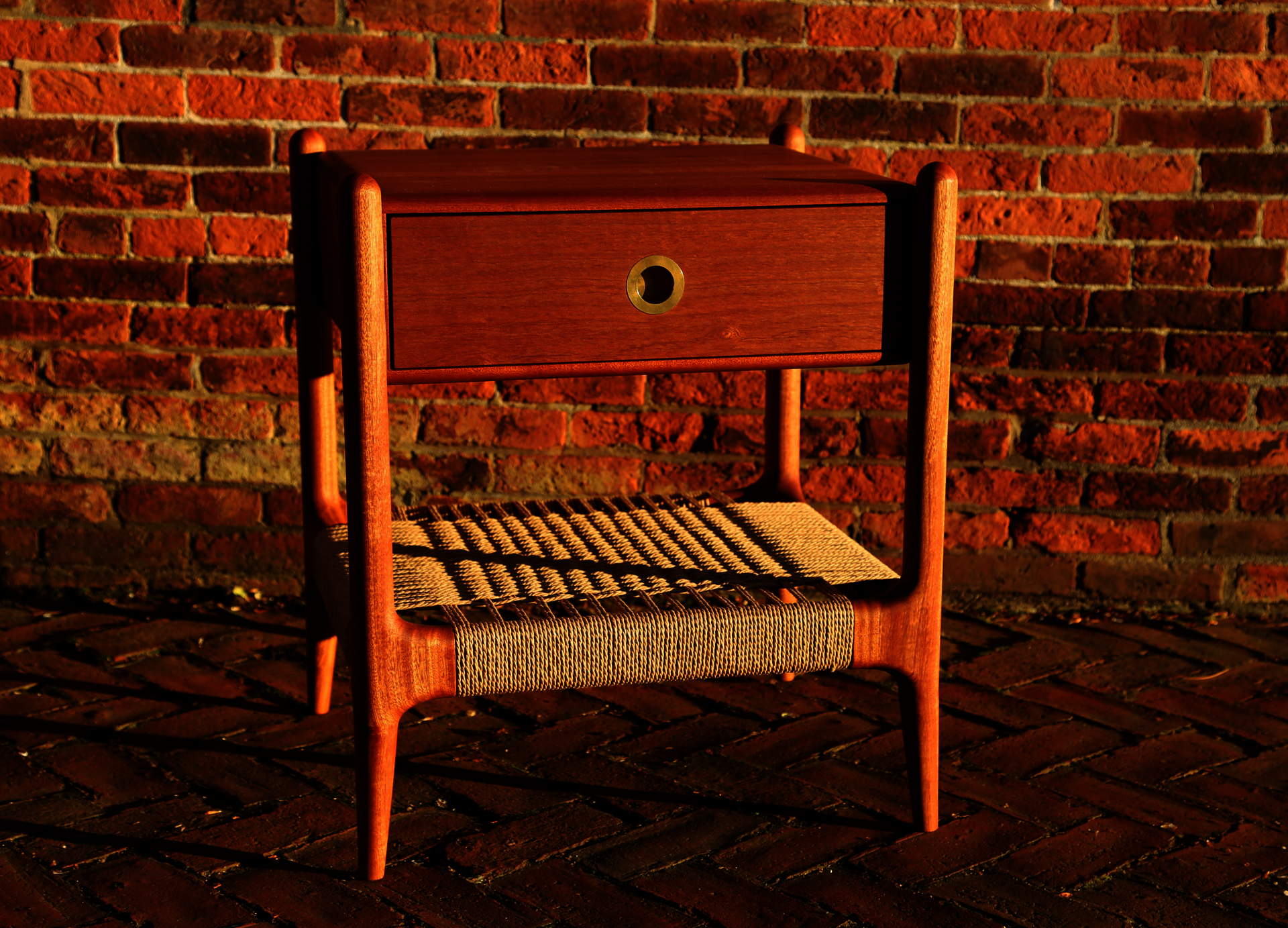 Sapele wood nightstand with brick background