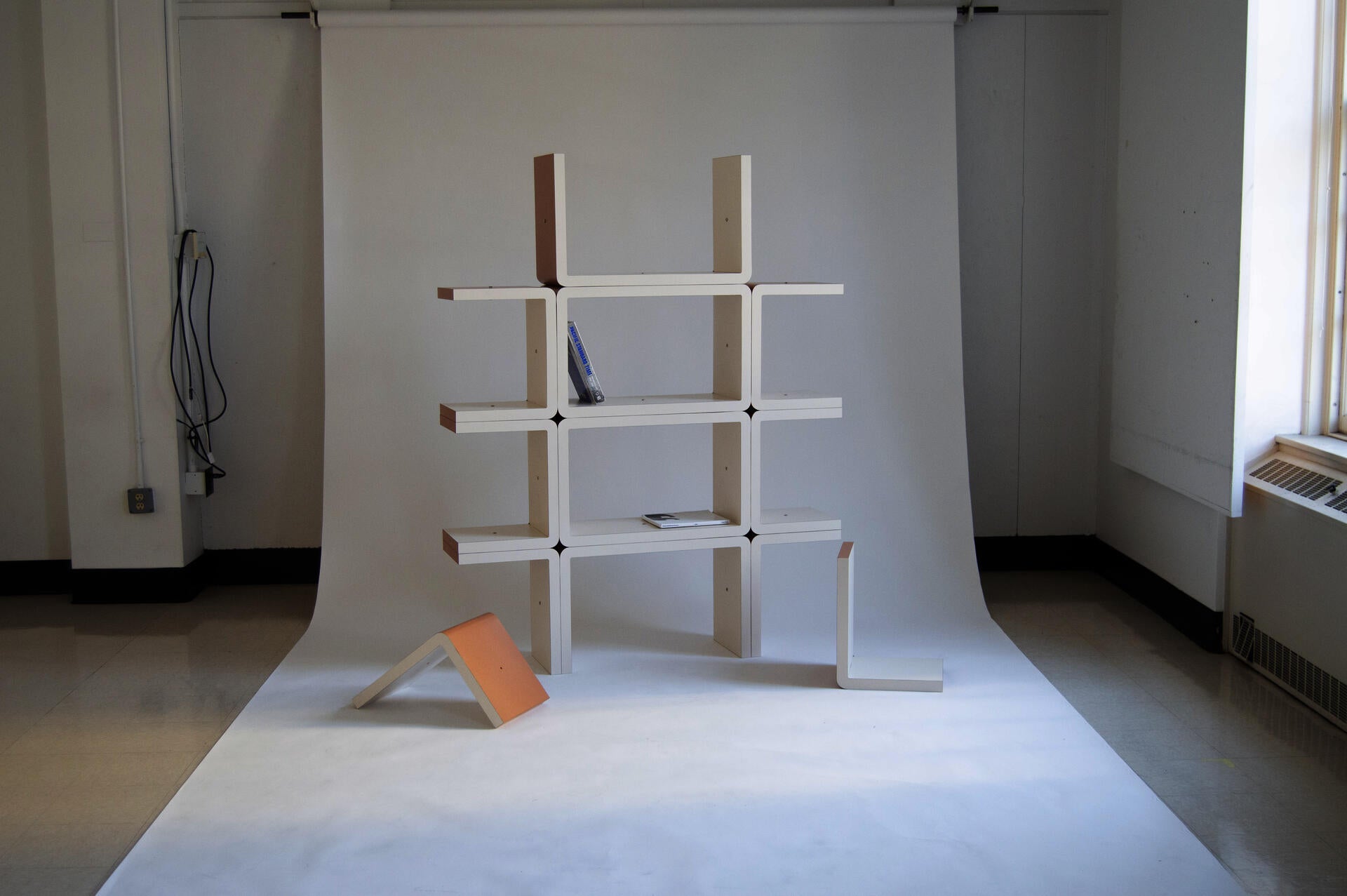 A modular shelving system that re-considers design and architectural references from the 60s/80s in a contemporary context.