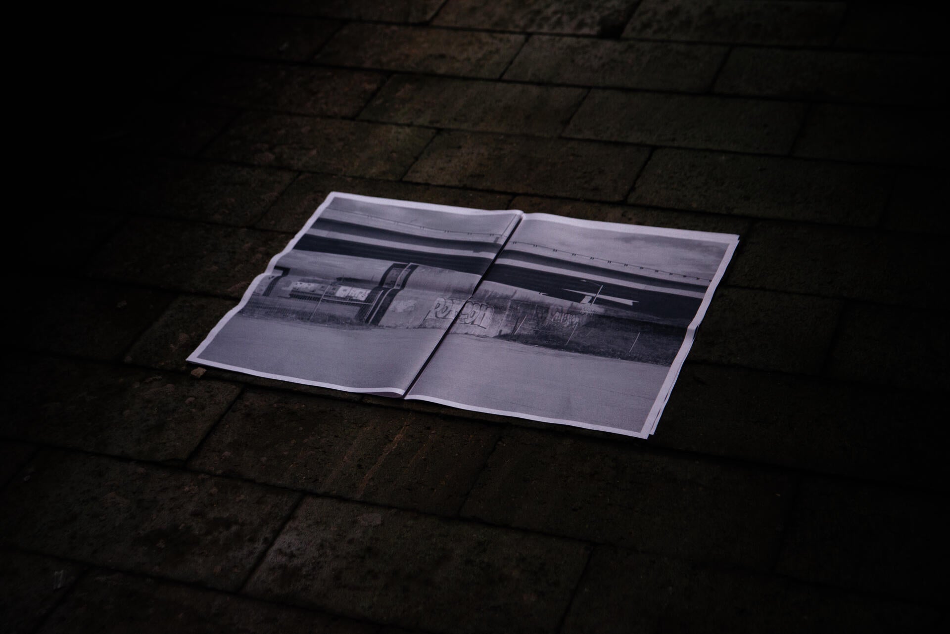 printed paper opened and laid on ground
