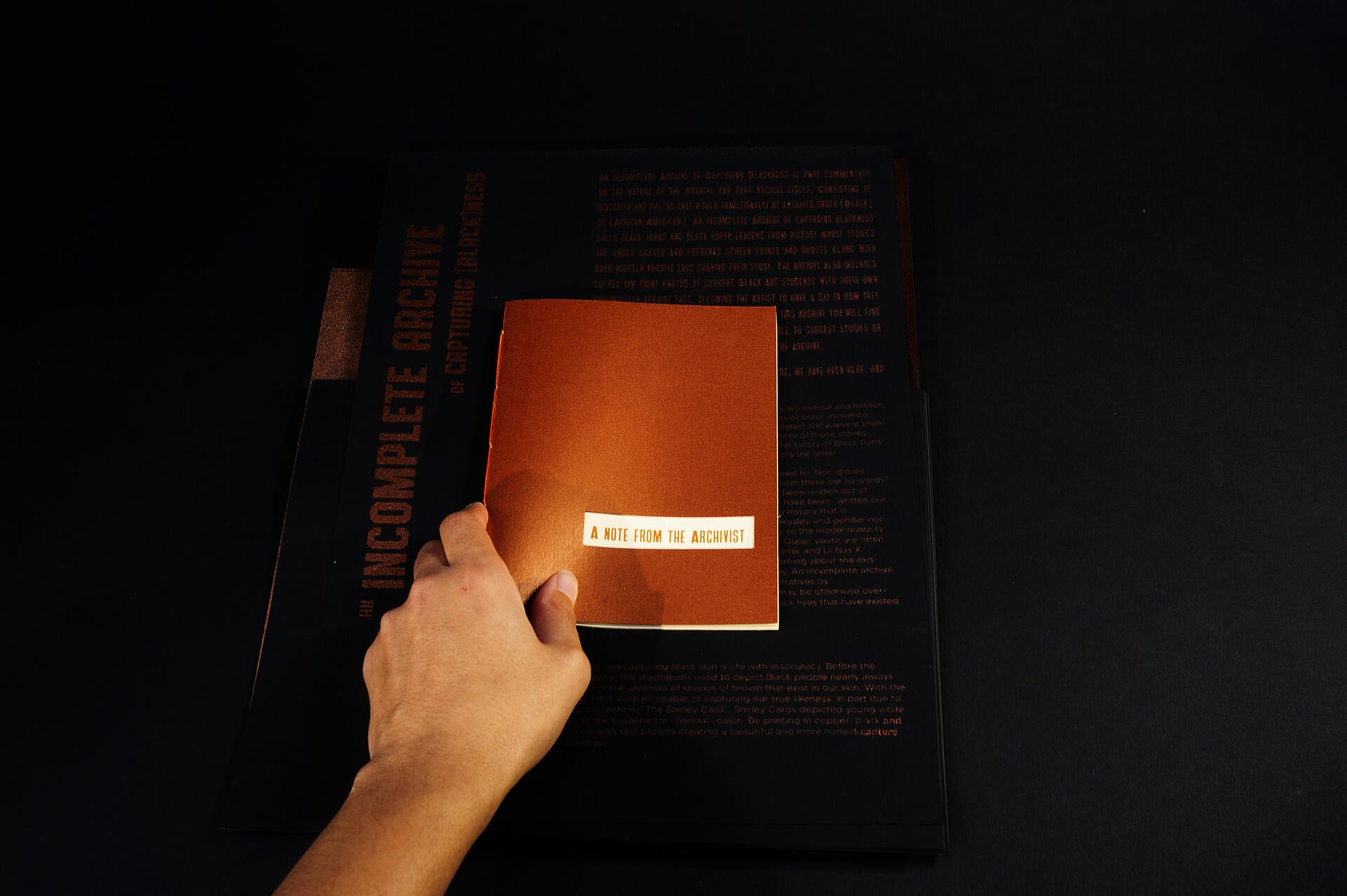 stack of copper colored prints