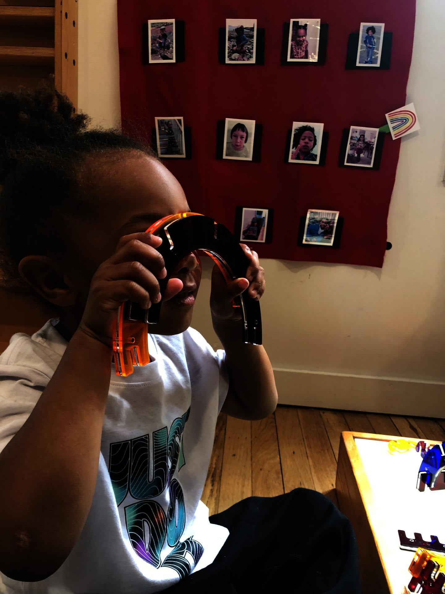Student engaging with wood and plexiglass series. 