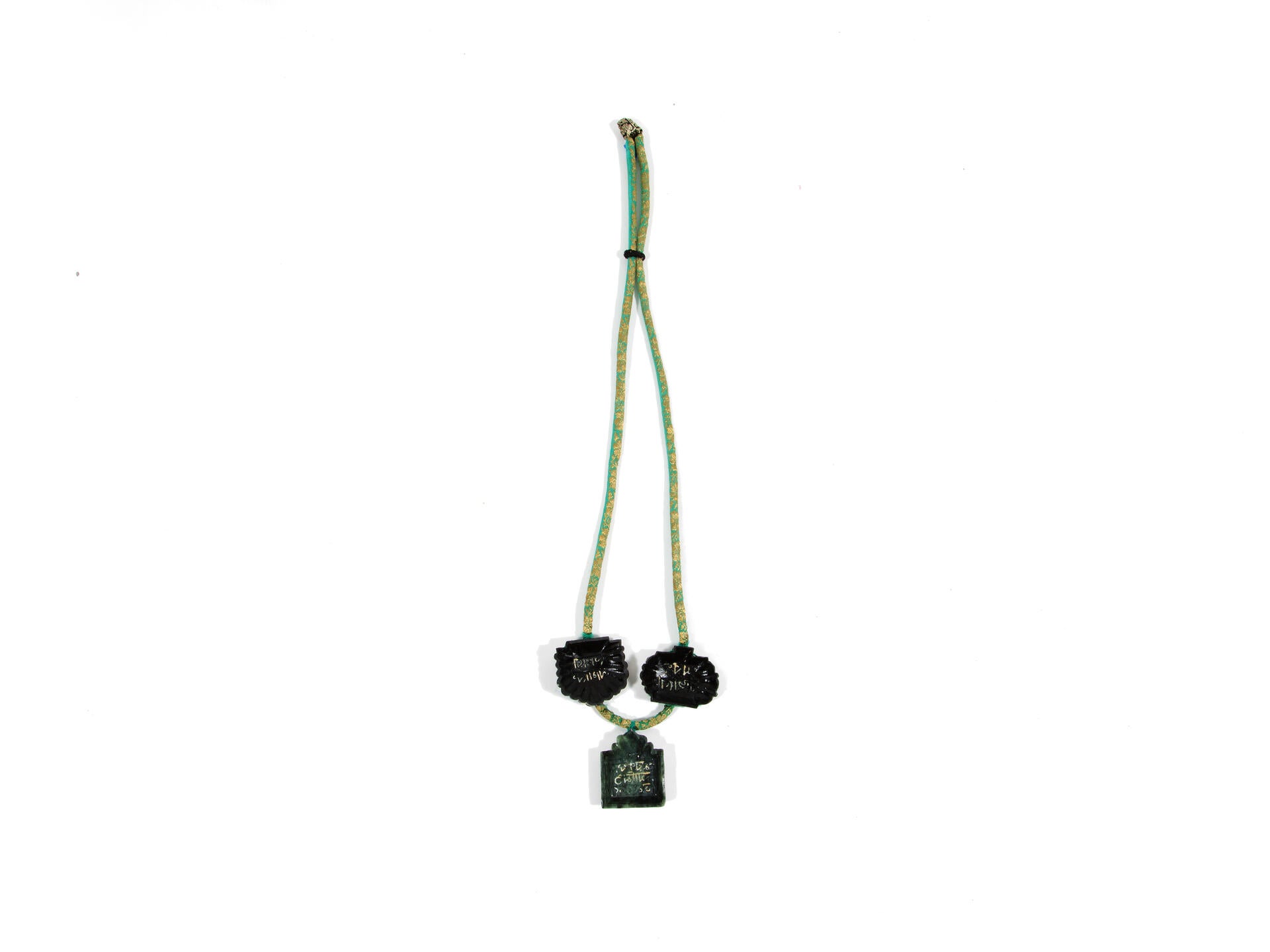 Necklace made with three soapstone confection molds and saree fabric.