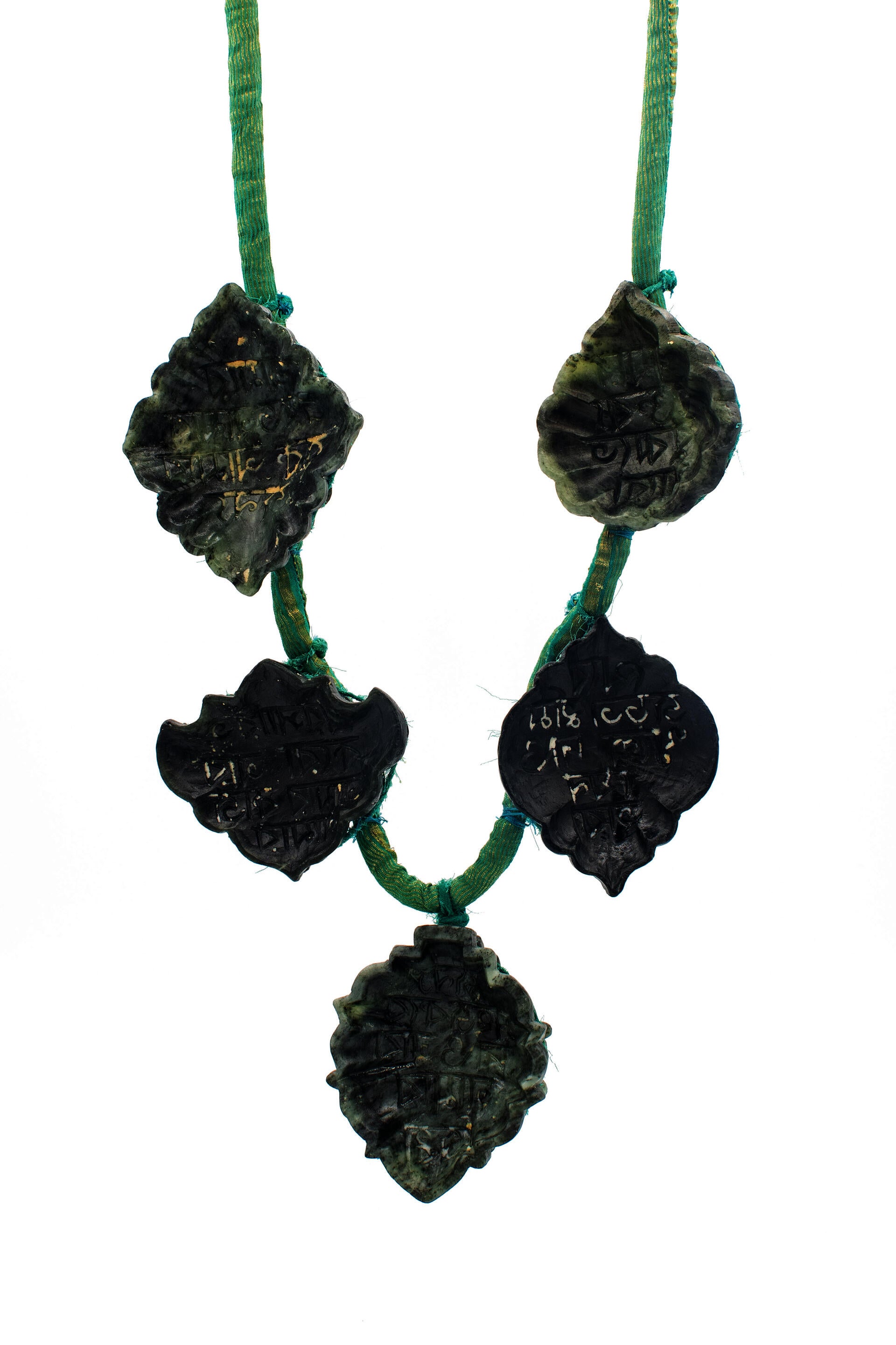 Necklace made with three soapstone confection molds and saree fabric.