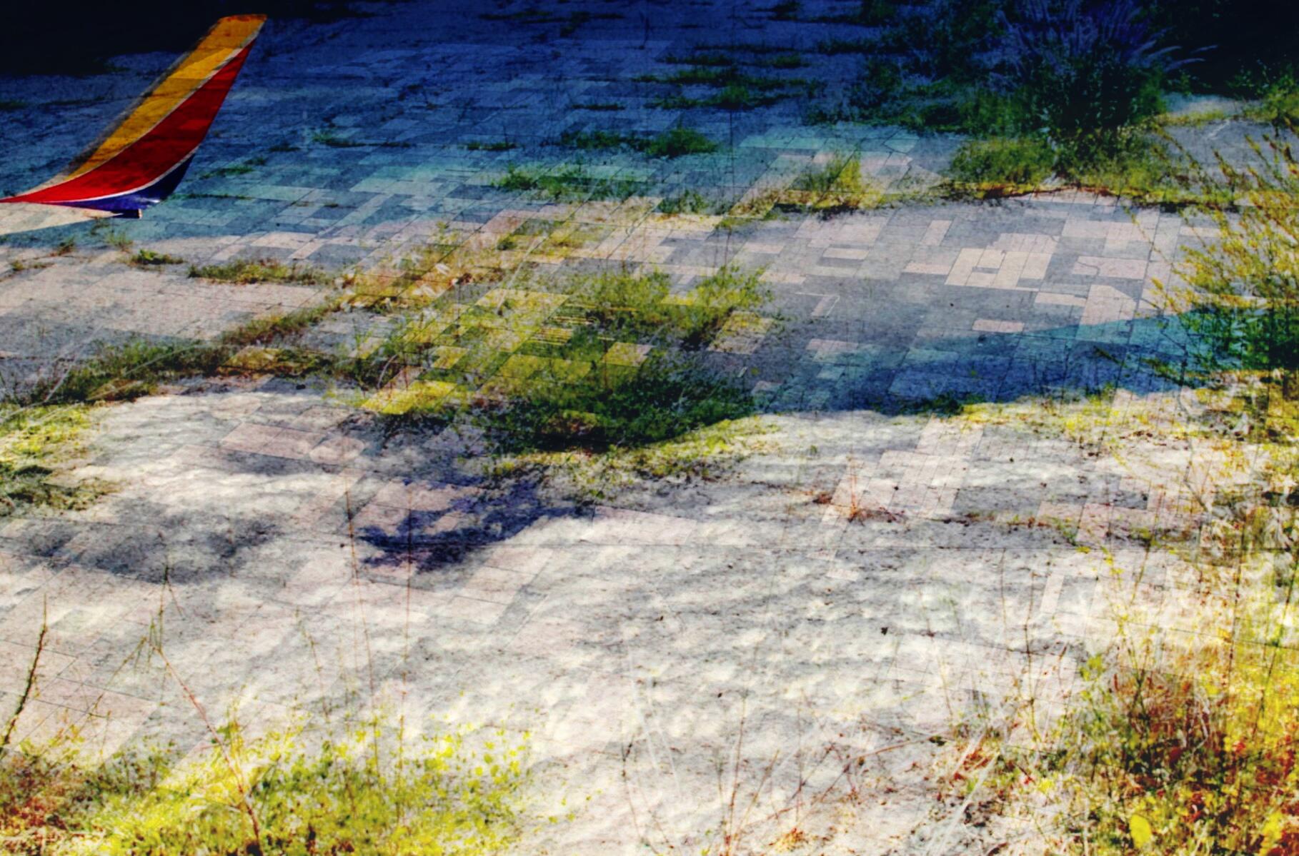 A collage of 3 landscape photographs at different scales (2 out of an airplane)superimposed with one another to create one ambiguous view full of clouds and grass.