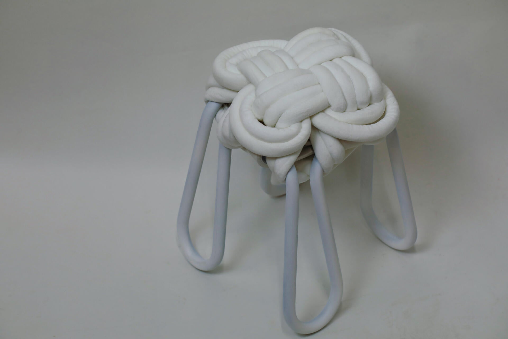 White knot stool on a white background