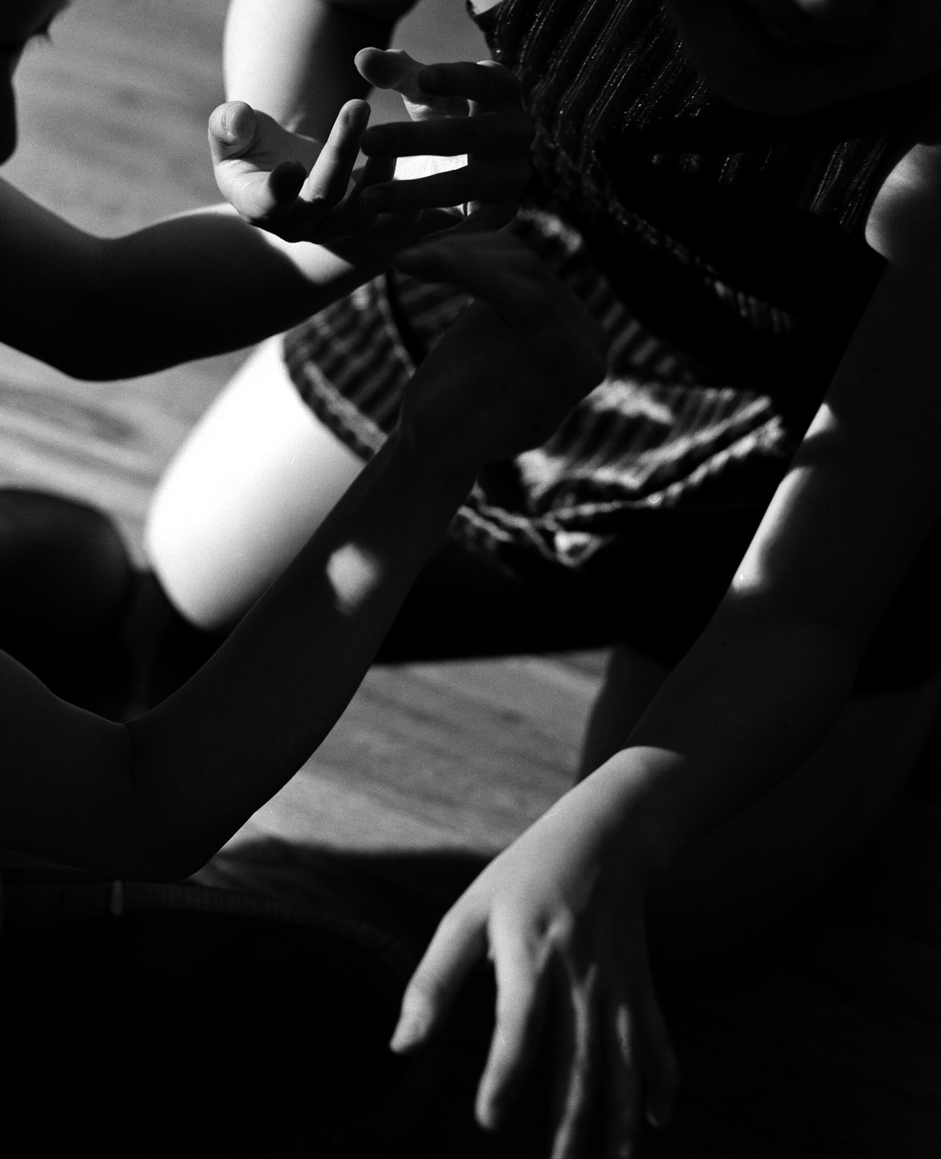 Two figures engaging in playful interaction.
