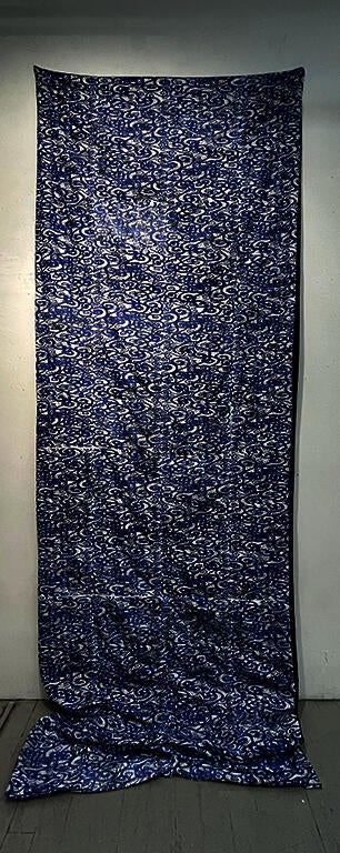 Letterpress and screen printing on fabric pieces quilted together