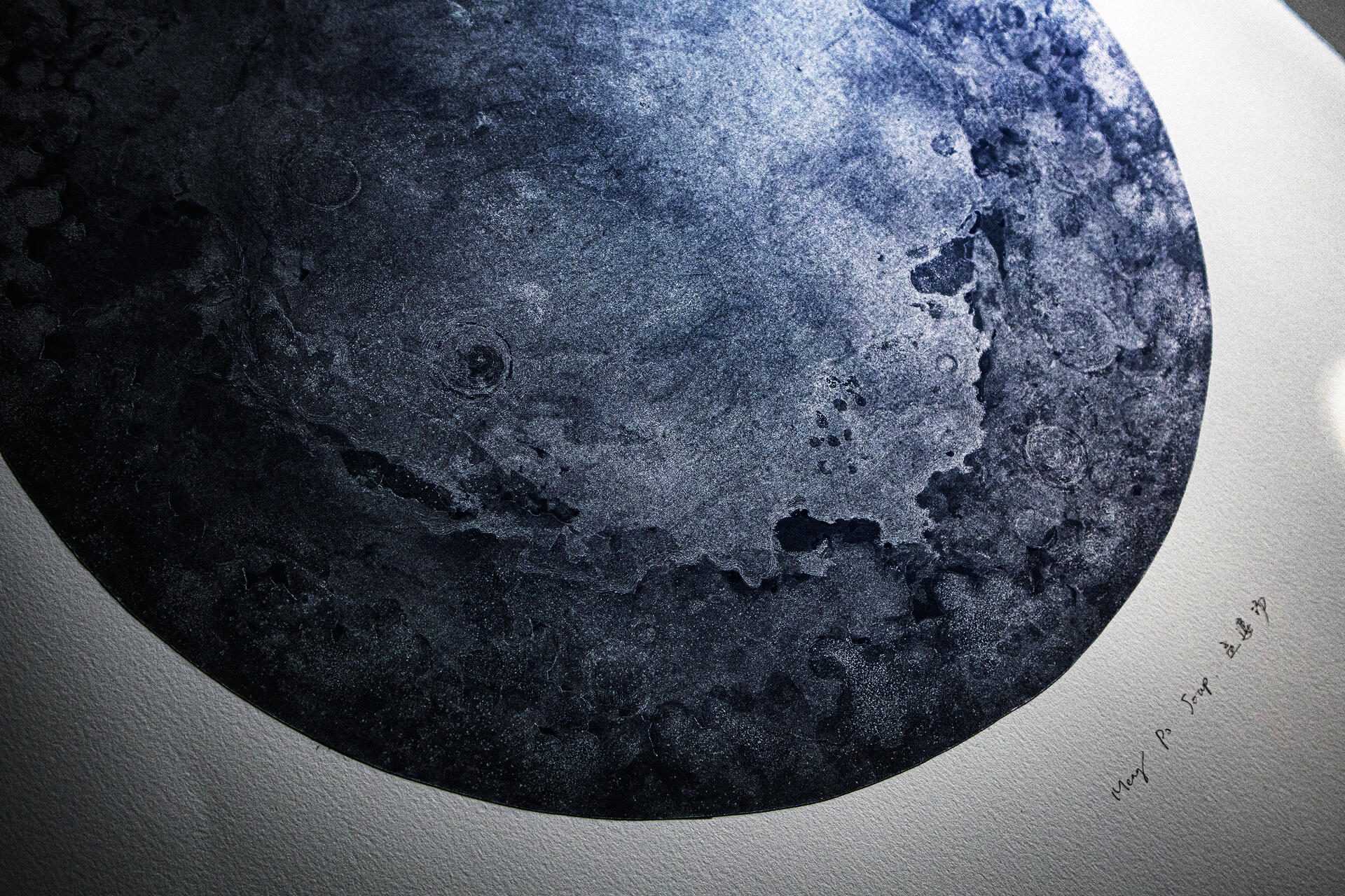 Detail of the silver moon, you can see the fog-like dark blue craters and silver plains.