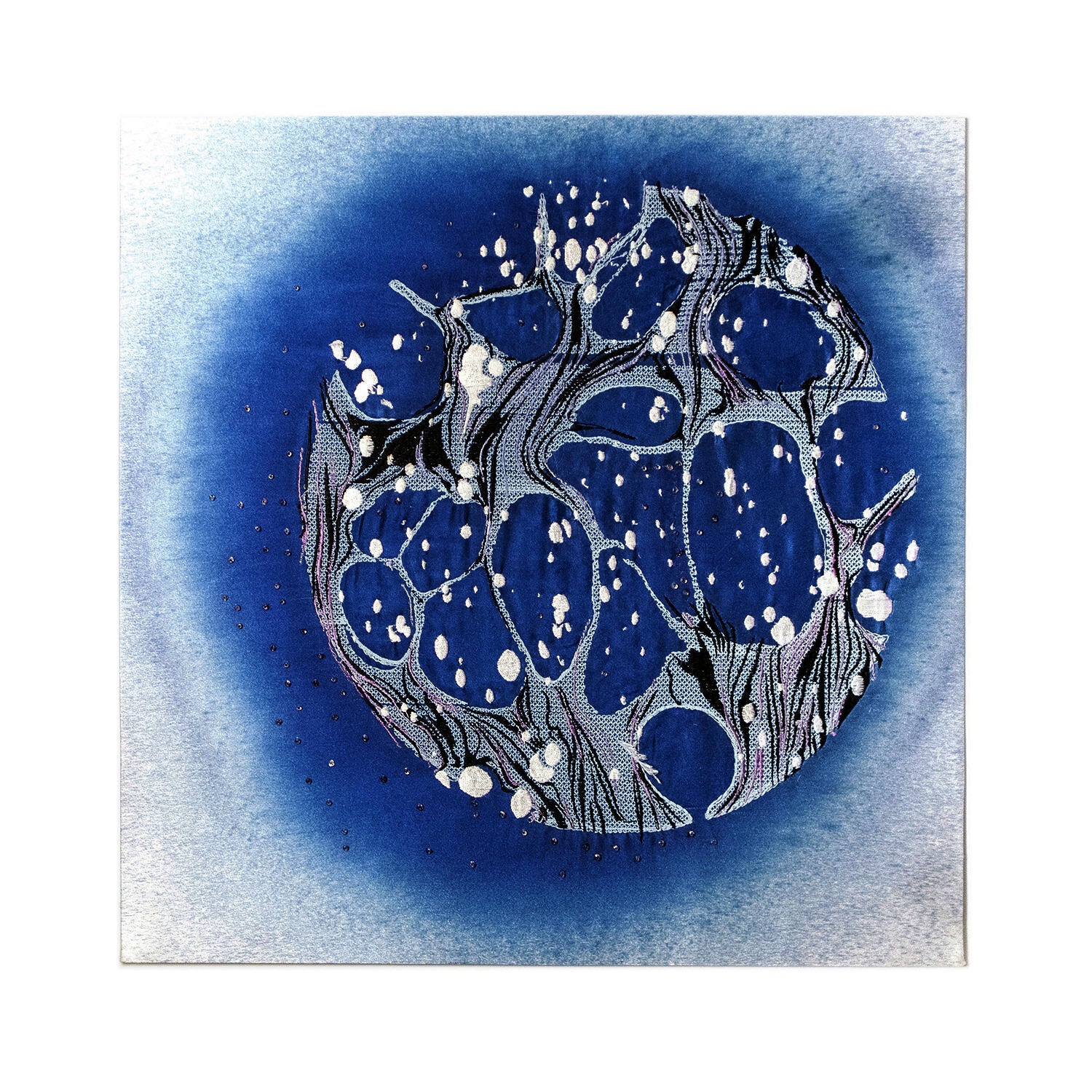 A round lake blue cyanotyped silk, I used the embroidery machine to make some bubble like and water reflective pattern