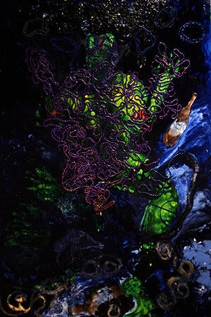 Alligator Figure surrounded by Mardi Gras beads and voodoo symbols