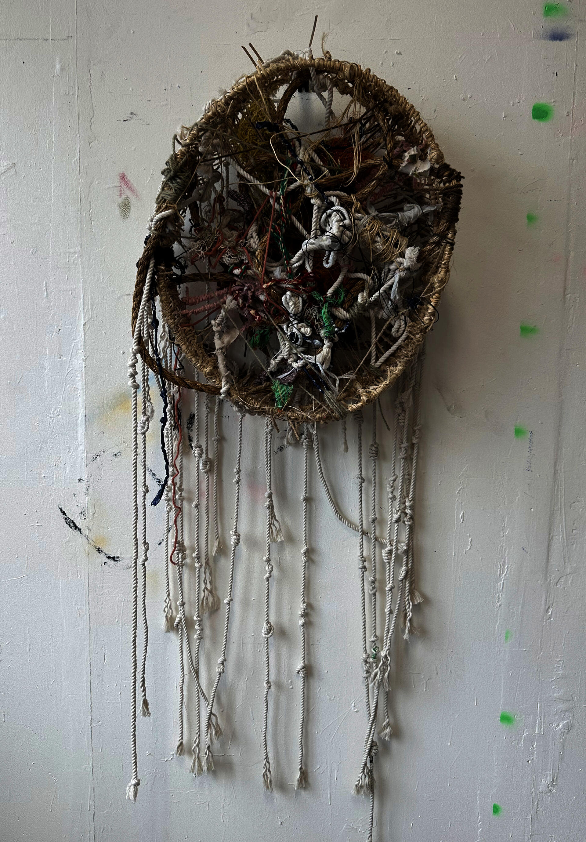 knotted, tied rope sculpture with hanging threads