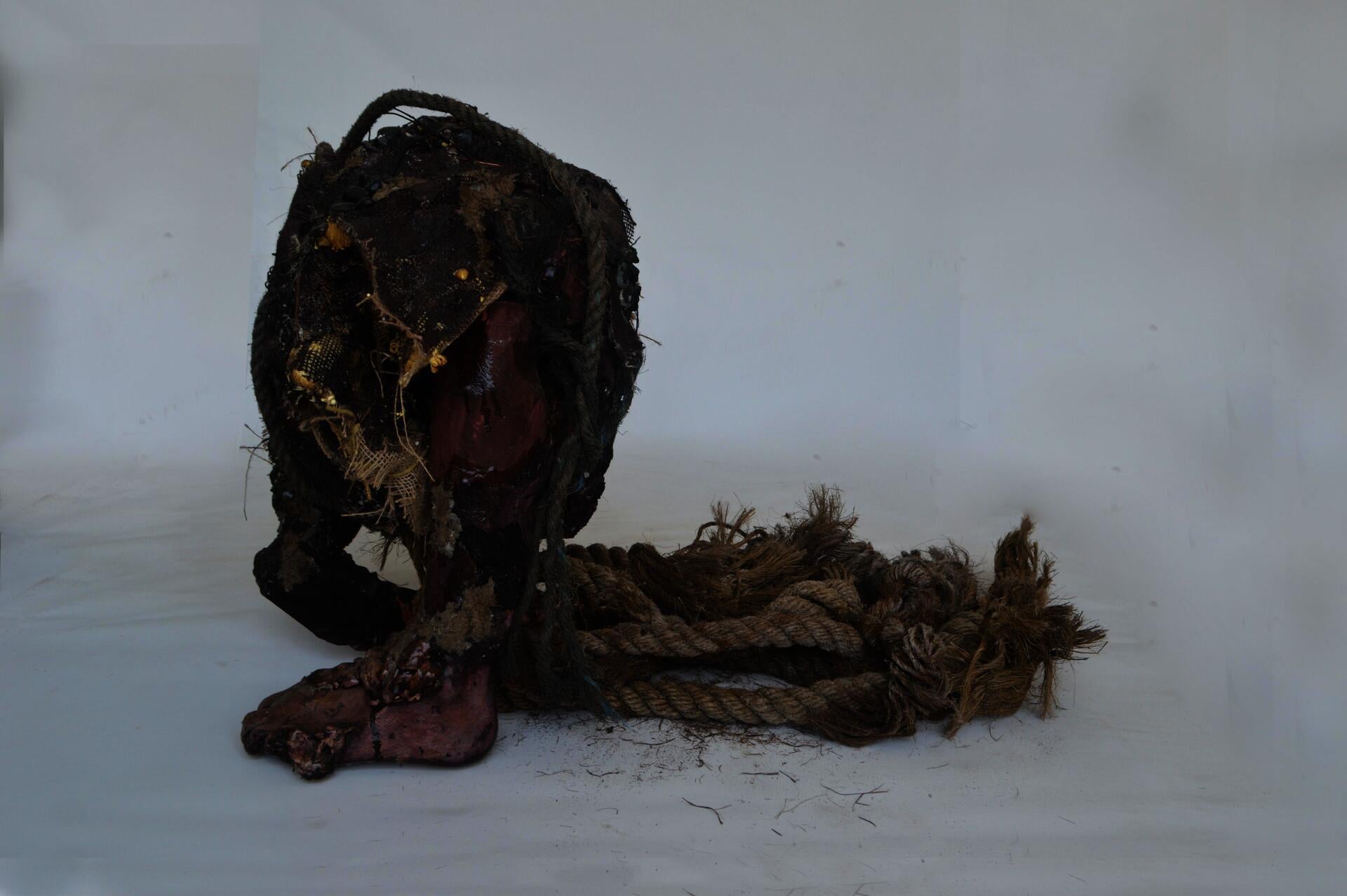 2023. Clay, plaster, rocks, rope, burlap, wire, paper, foam, wood stain.
