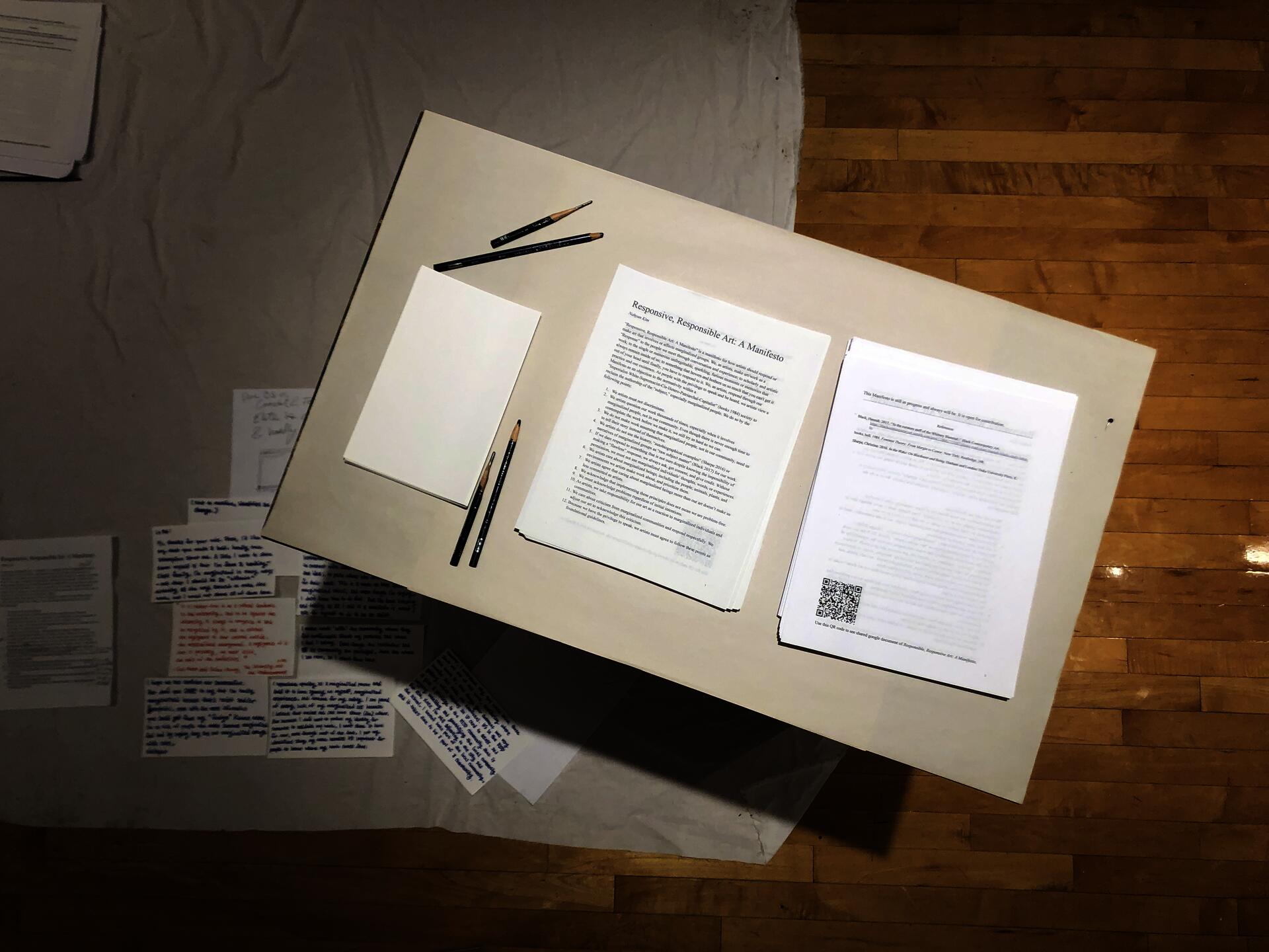 Two pages of “Responsive, Responsible Art: A Manifesto” displayed in a Google Doc. The left page shows a title, introduction paragraph, and a list of guidlines, while the right page presents references and a QR code for reader contributions. All text is black on a white background, except for a link to an article on the reference list.