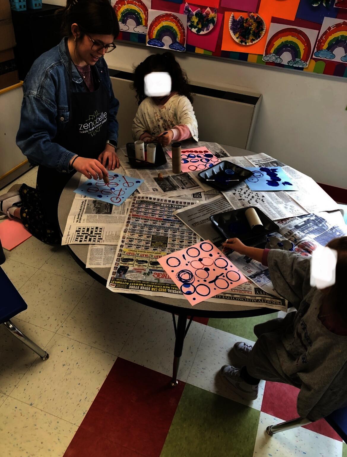 Pre-K students at Colt Andrews Elementary School explore recycled materials to create prints. Photographed by Lynne Ramos.