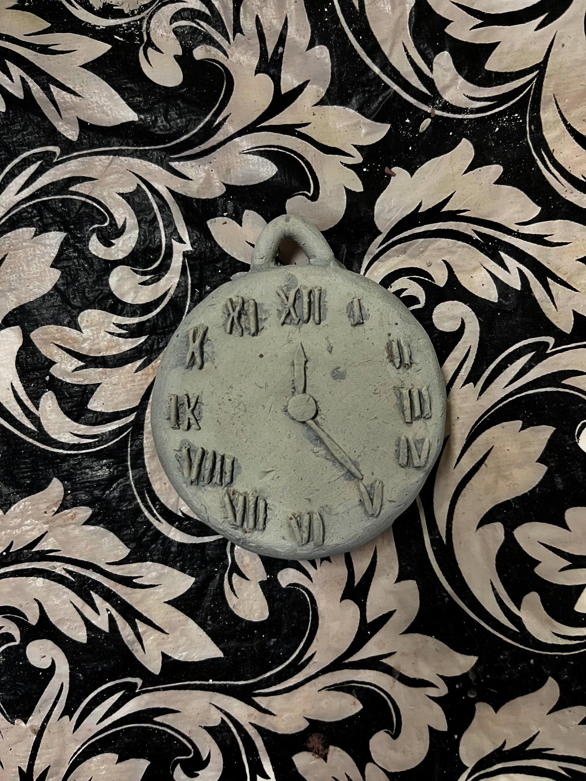 Pilgrim High School student creates ceramic pocket watch (in-progress).