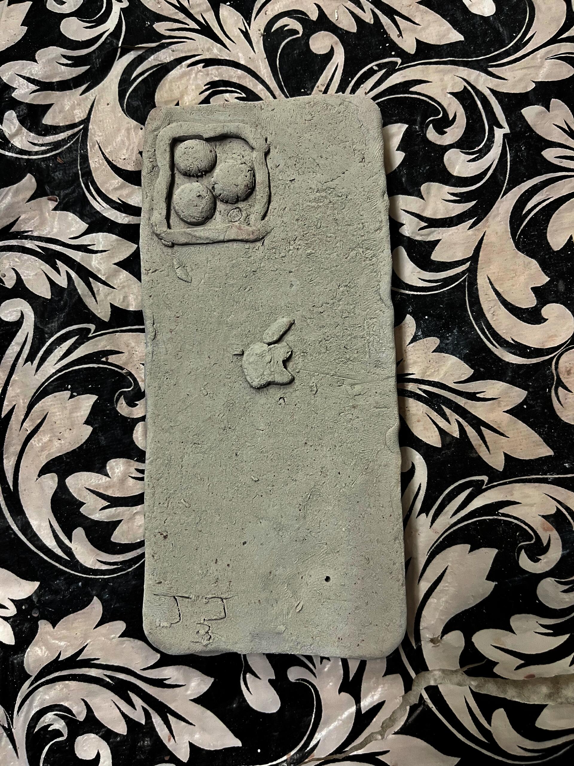 Pilgrim High School student creates ceramic iPhone (in-progress).
