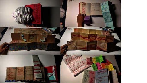 Thesis research notes in an accordion book.