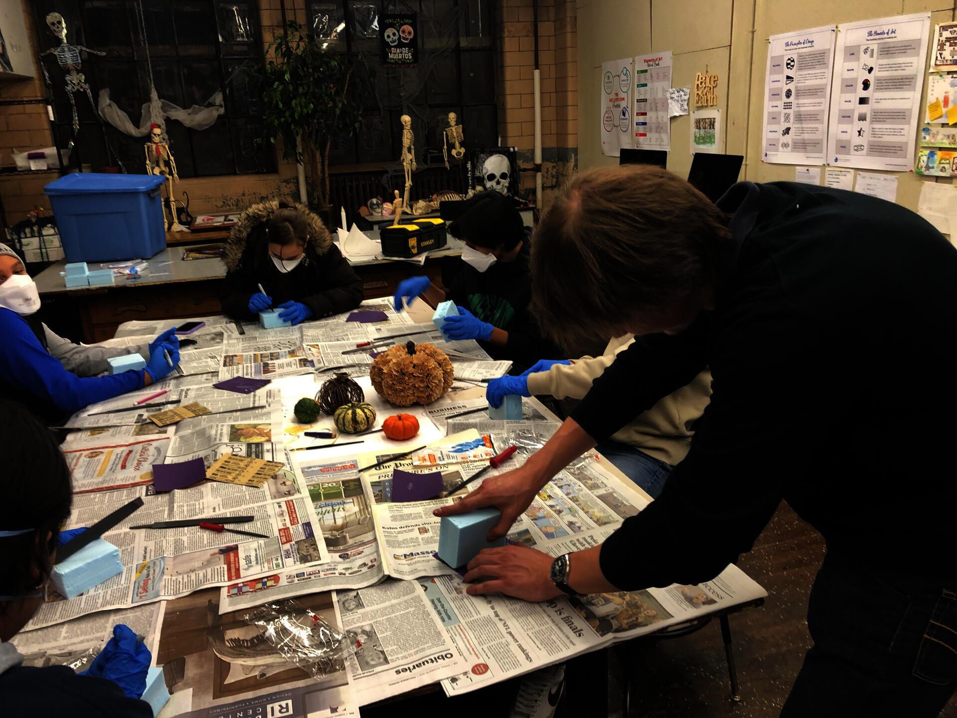 Seva Simone demo’ing working with blue foam in his Project Open Door class called Design the Future at Hope High School. 