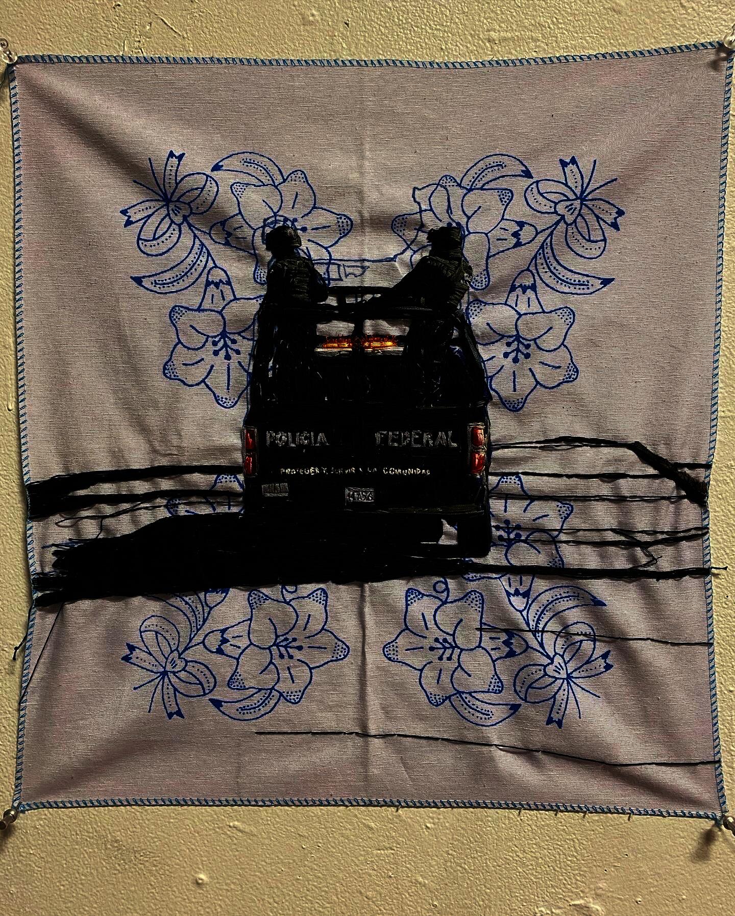 mexican federal police embroidered of on a cloth with floral pattern.