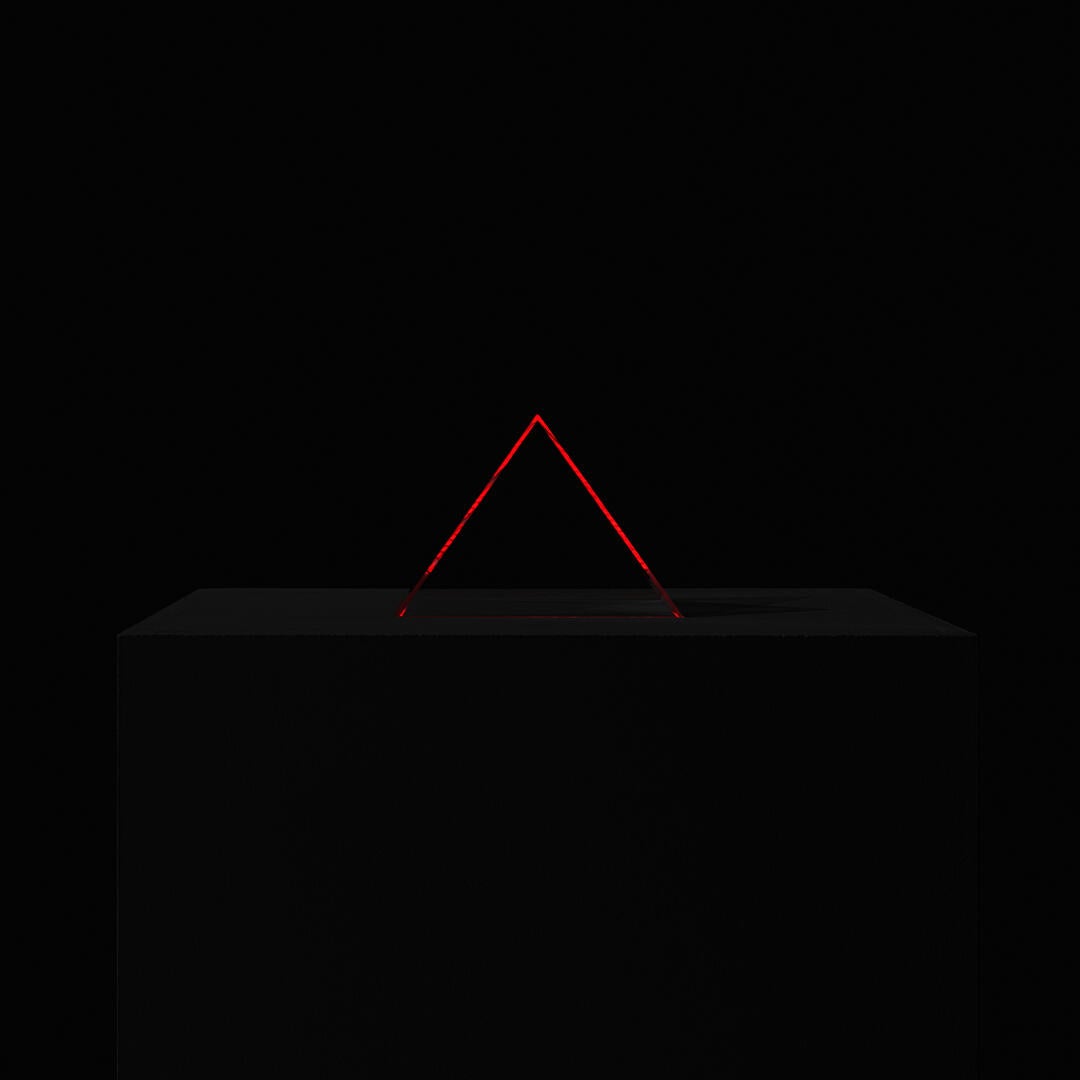 A transparent pyramid glows with its surrounding sound.