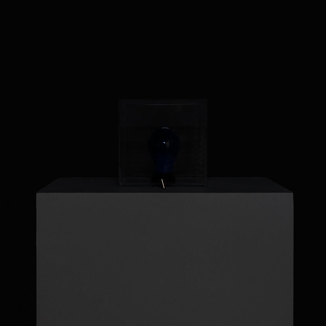 A square lamp with a toggle switch in the front.