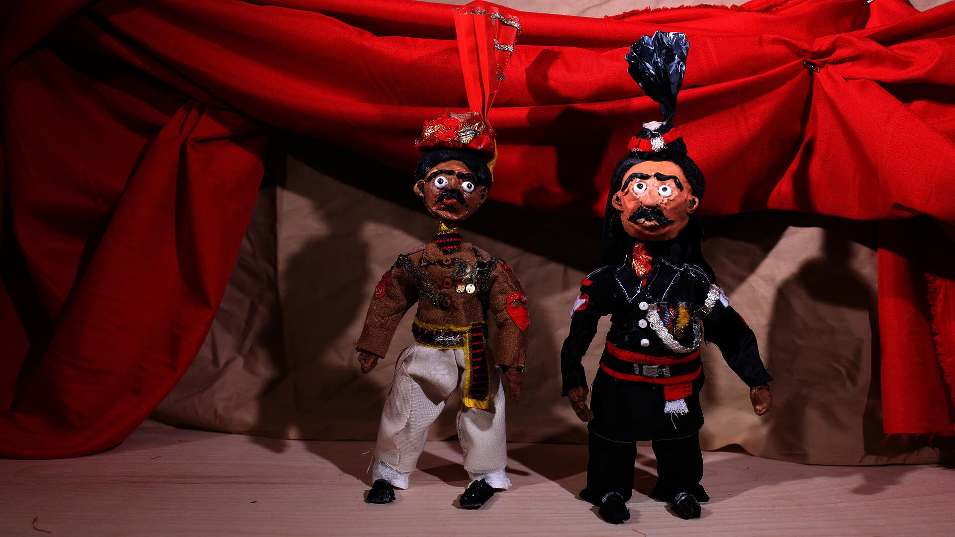 Two soldiers on a theatrical stage set reimaging India-Pakistan border ceremony