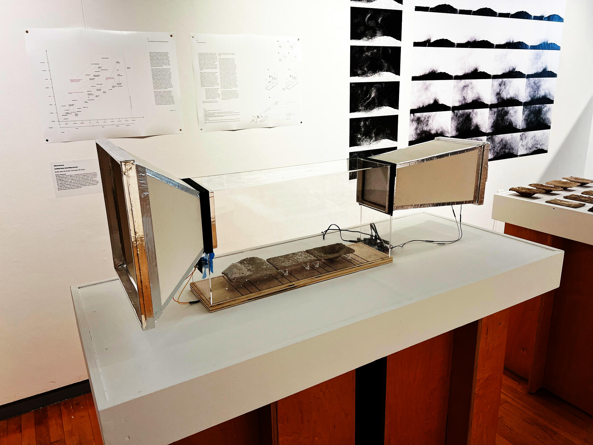 Acrylic chamber with paper cones on both ends and DC motors attached