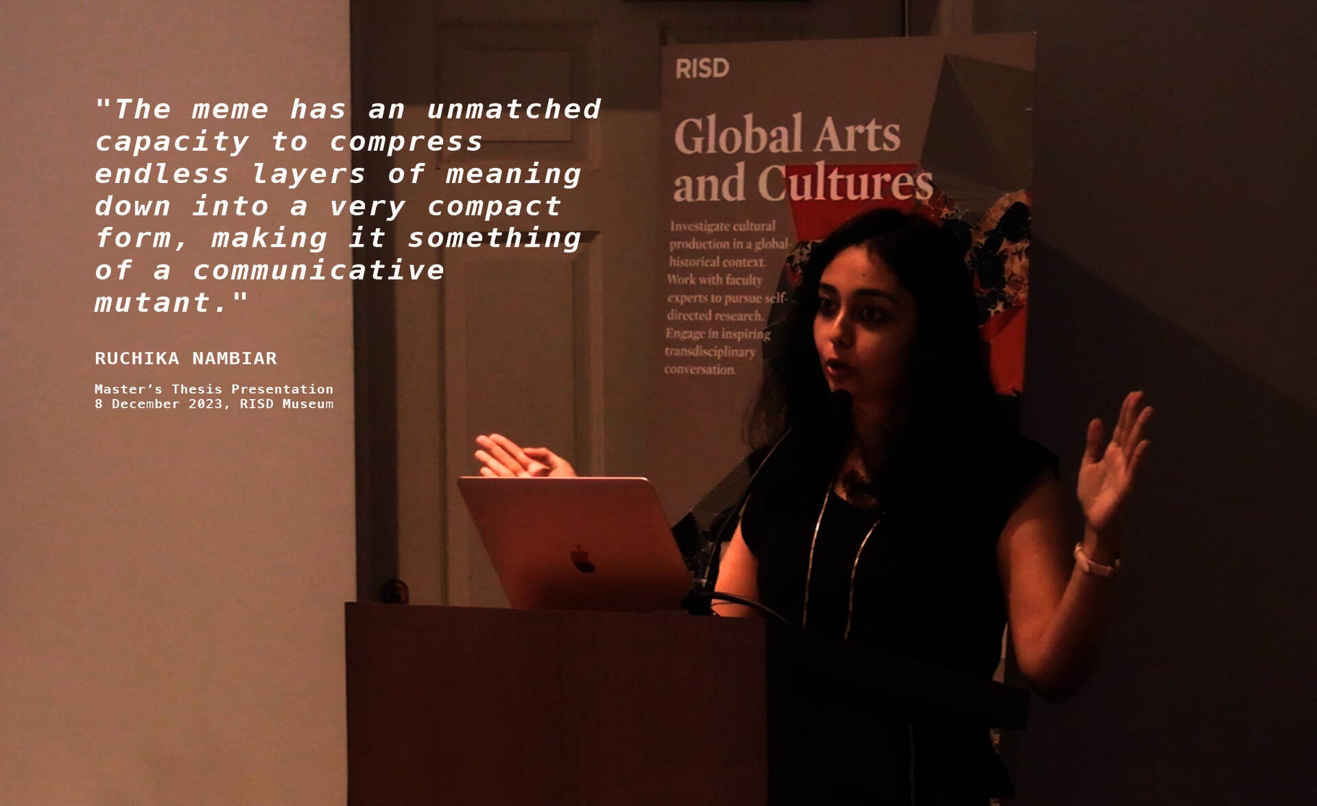 Ruchika Nambiar standing at a podium and speaking into a mic, along with a corresponding slideshow playing on the side.
