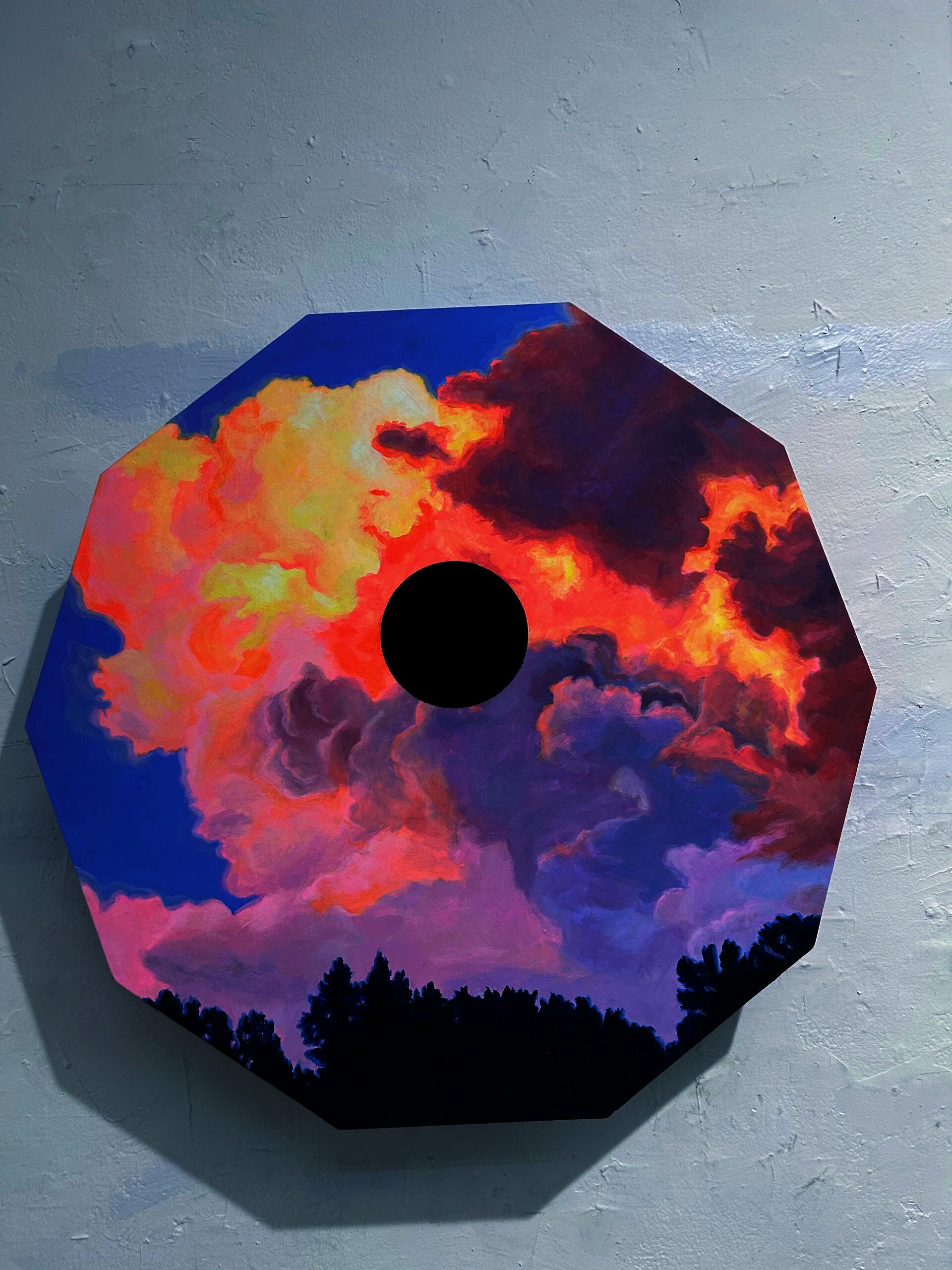 Cloud with black hole in center. 