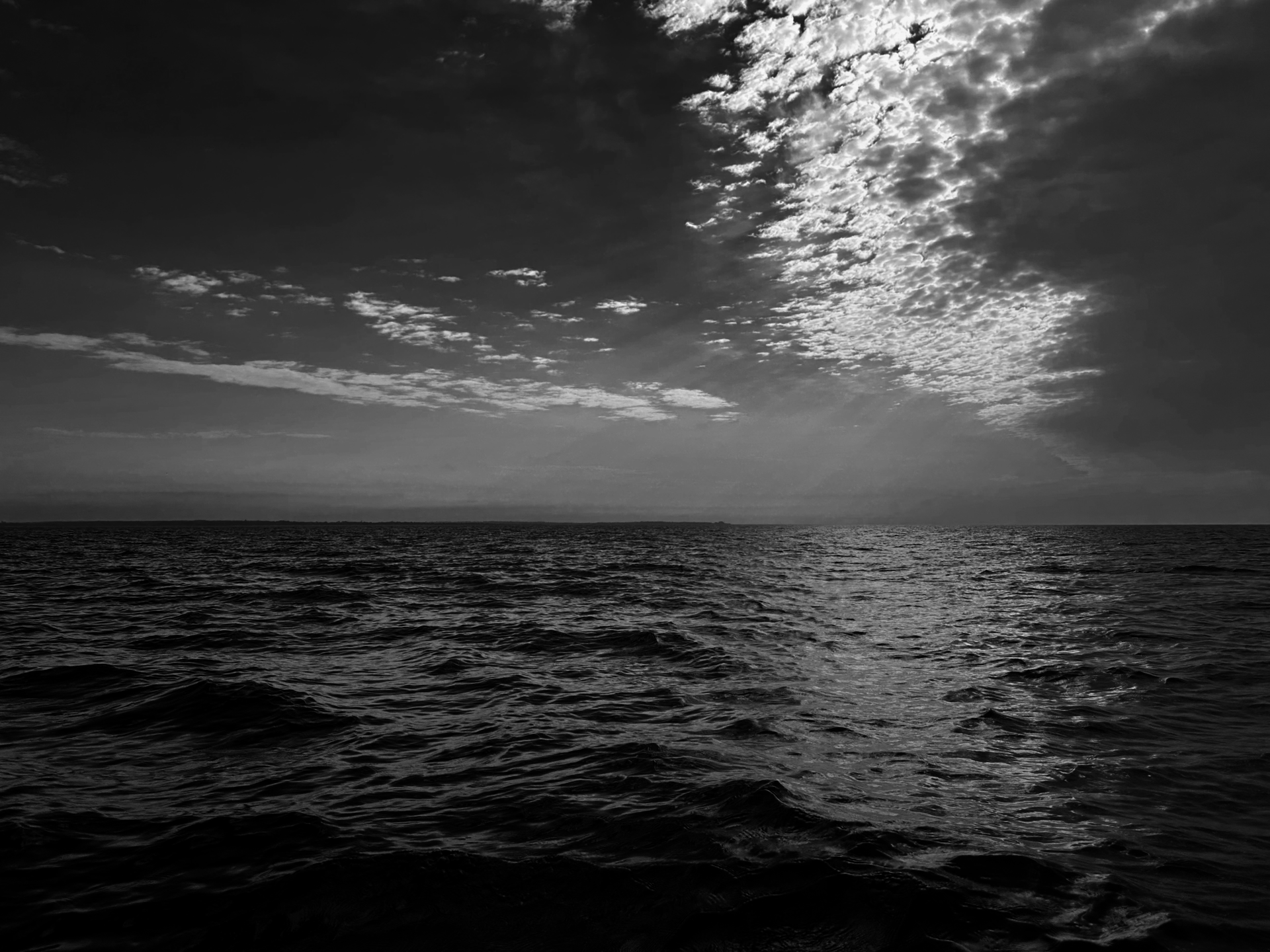black and white shot of the ocean
