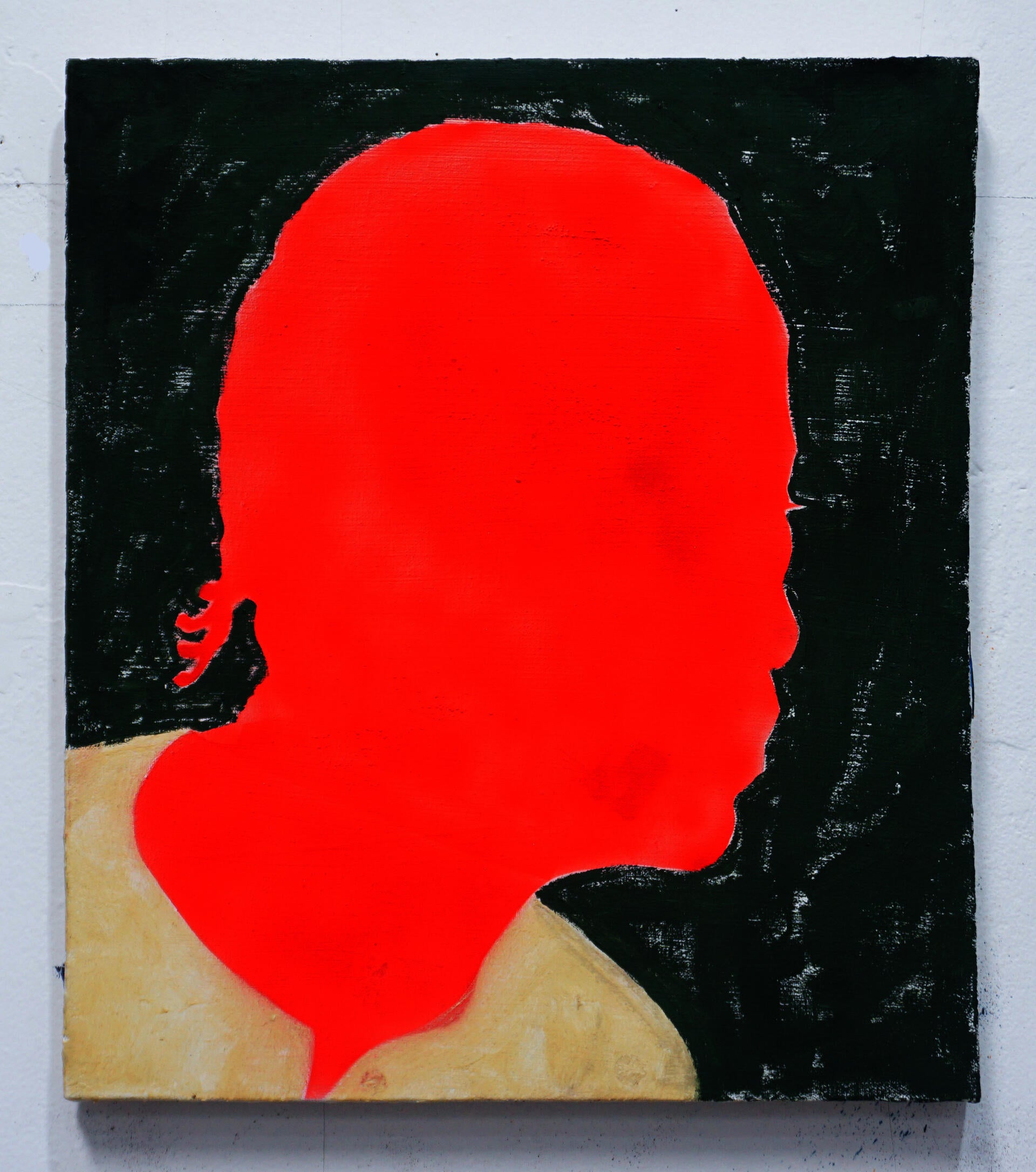 The bright red silhouette of a figure with cornrows is surrounded by a patchy forest green and wears a simple tan shirt. 